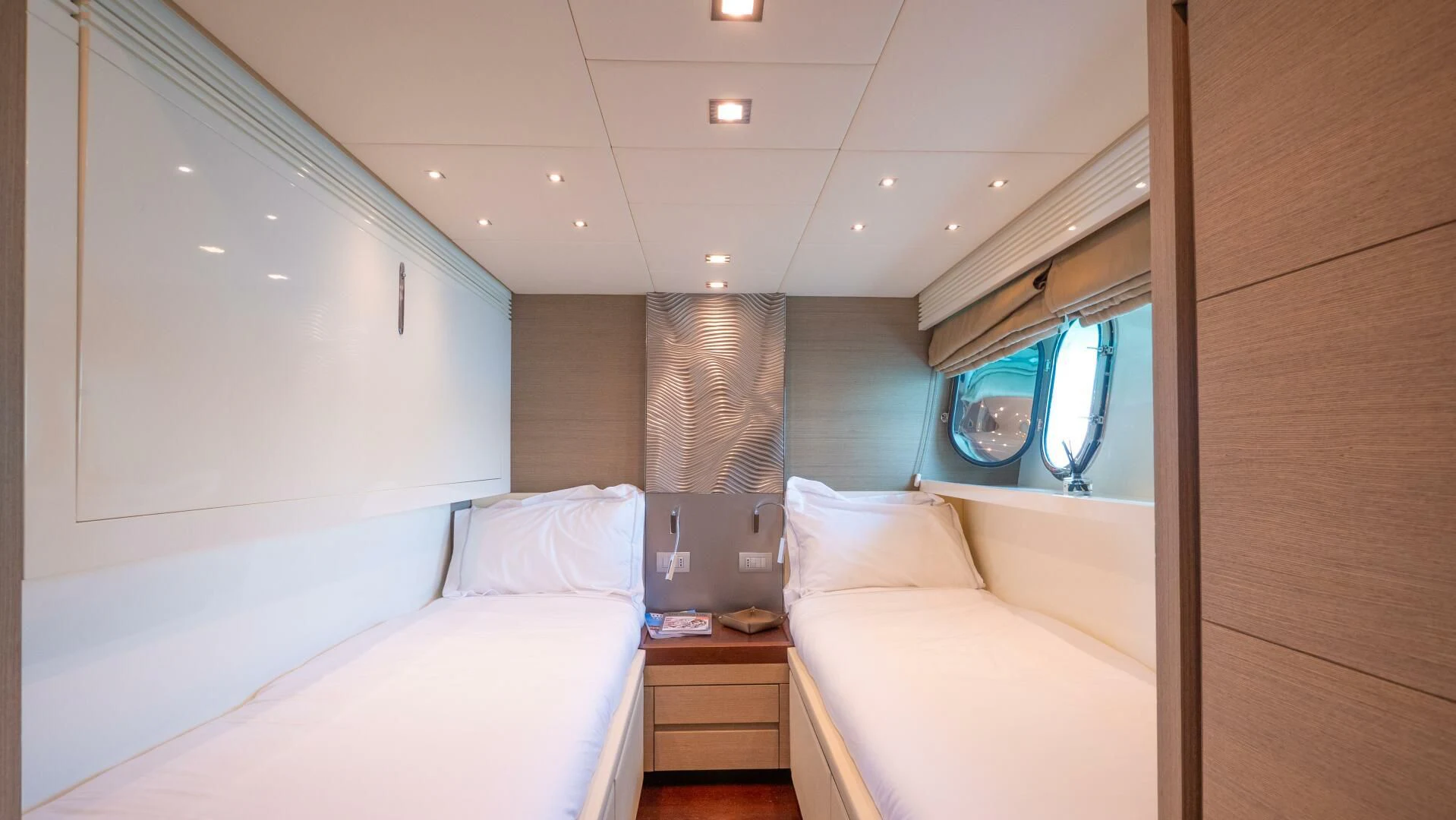 a room with a bed and a television aboard DADDY'S DREAM 888 Yacht for Charter