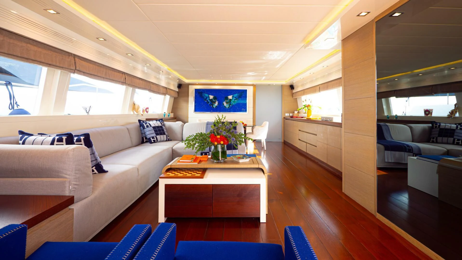 a living room with a couch and a table aboard DADDY'S DREAM 888 Yacht for Charter