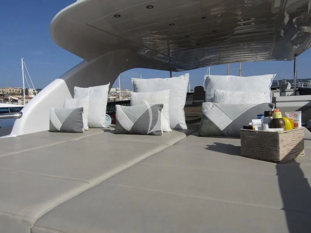 a patio with a large white bed aboard DADDY'S DREAM 888 Yacht for Charter