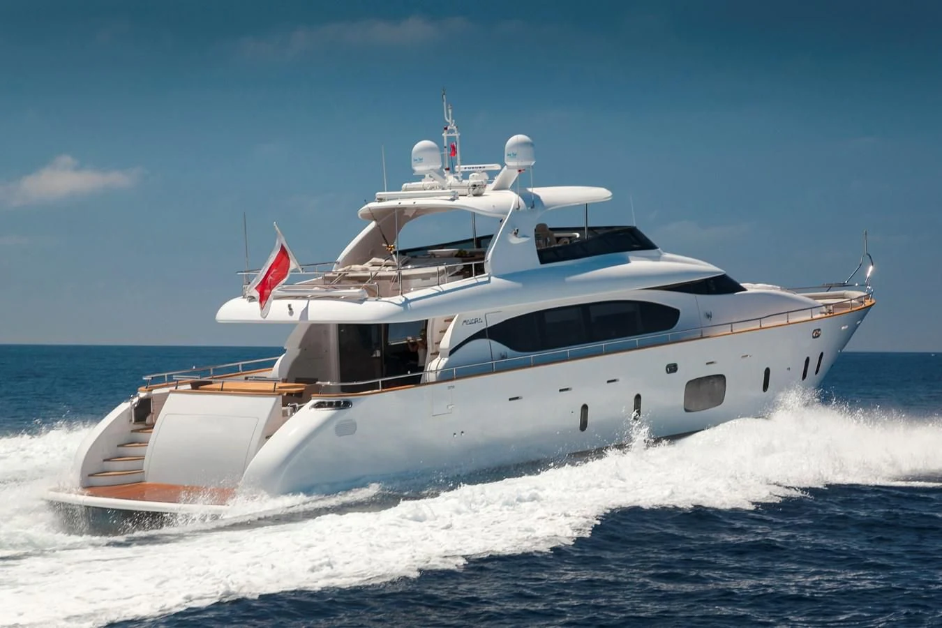 a white yacht on the water aboard DADDY'S DREAM 888 Yacht for Charter