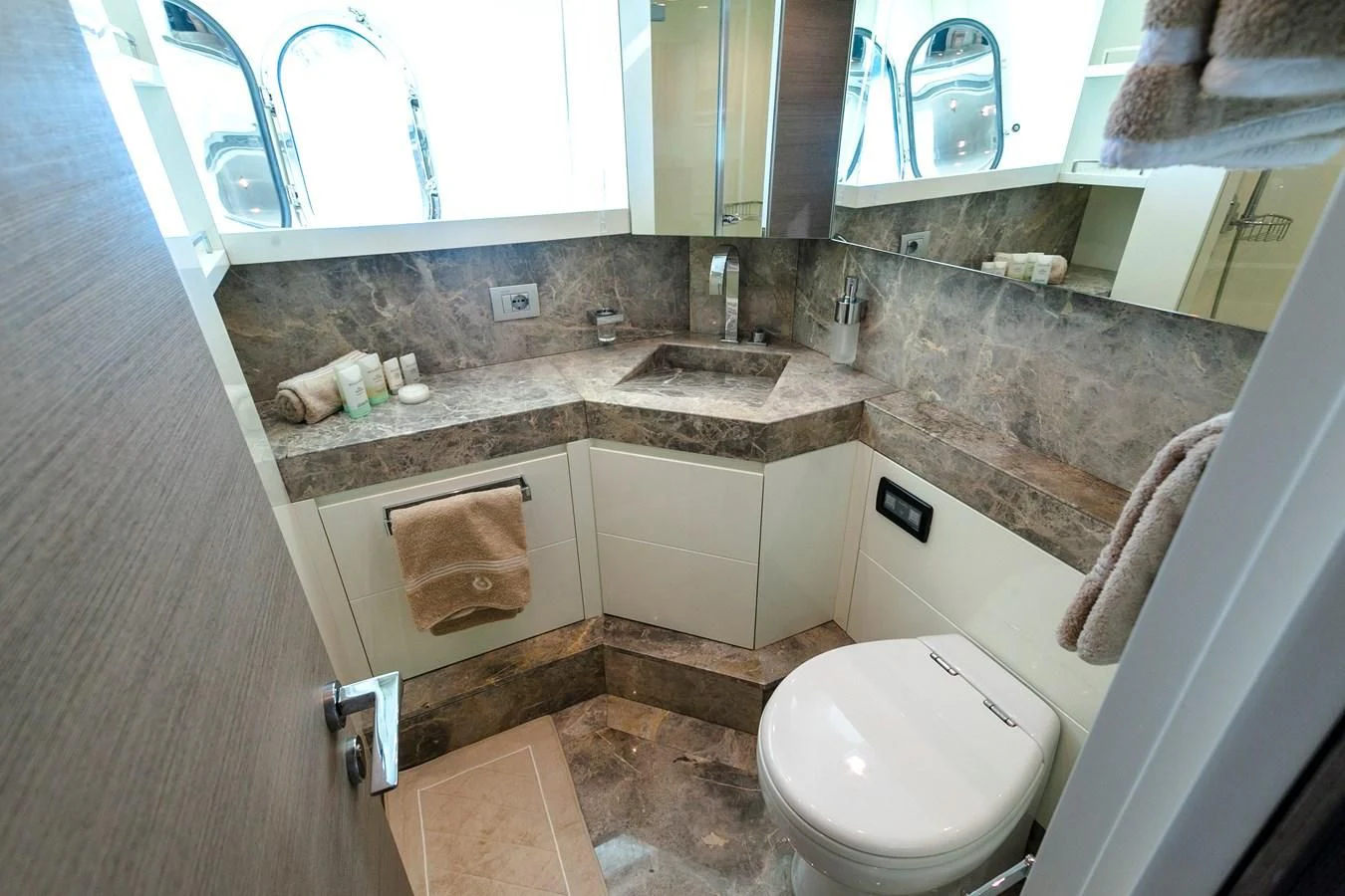 a bathroom with a sink and a toilet aboard DADDY'S DREAM 888 Yacht for Charter