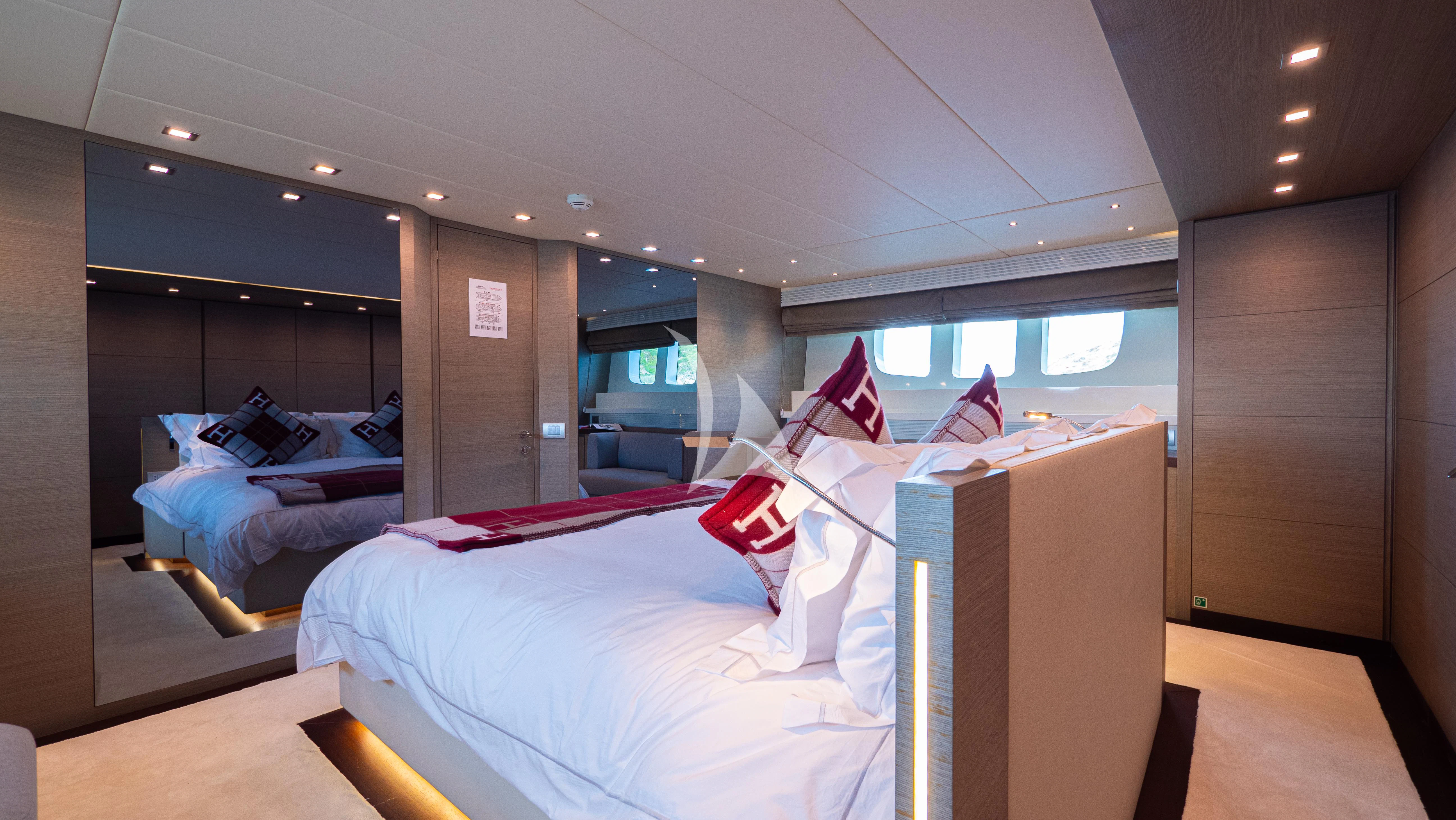 a room with beds and a window aboard DADDY'S DREAM 888 Yacht for Charter