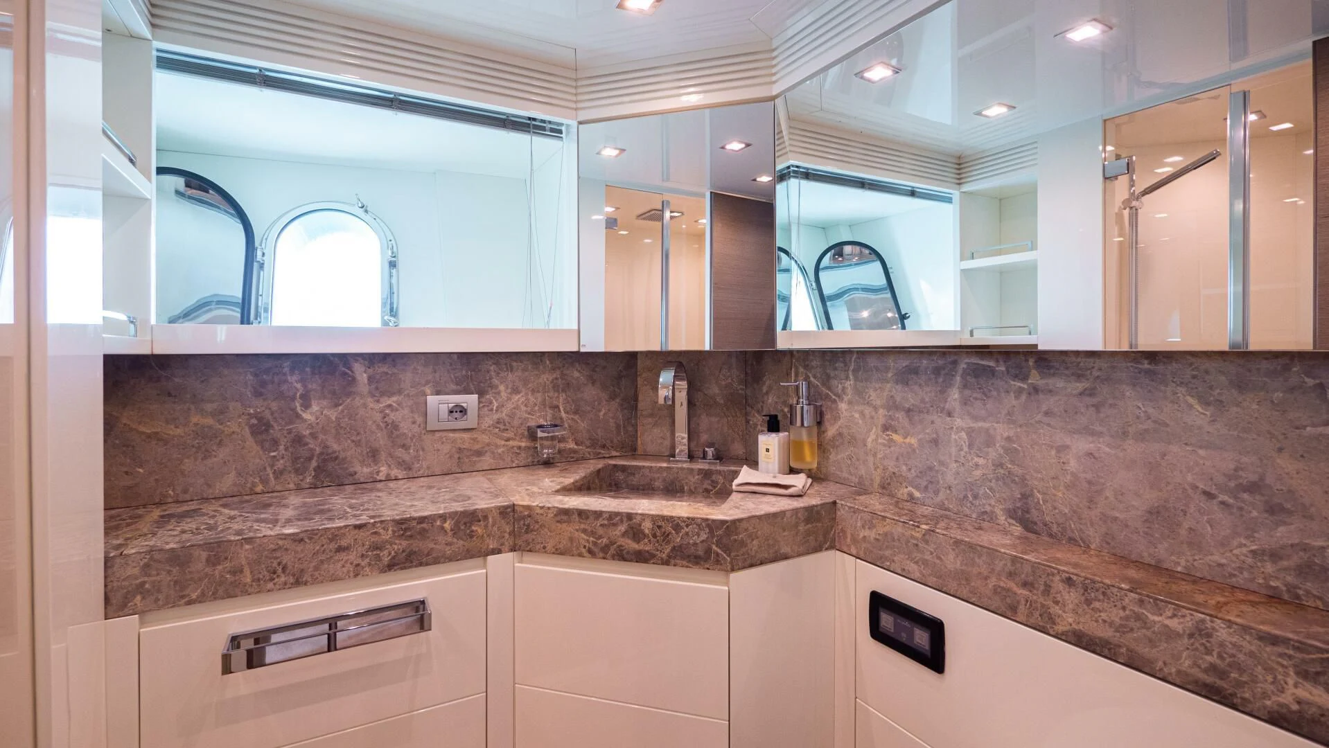 a bathroom with a marble counter top aboard DADDY'S DREAM 888 Yacht for Charter