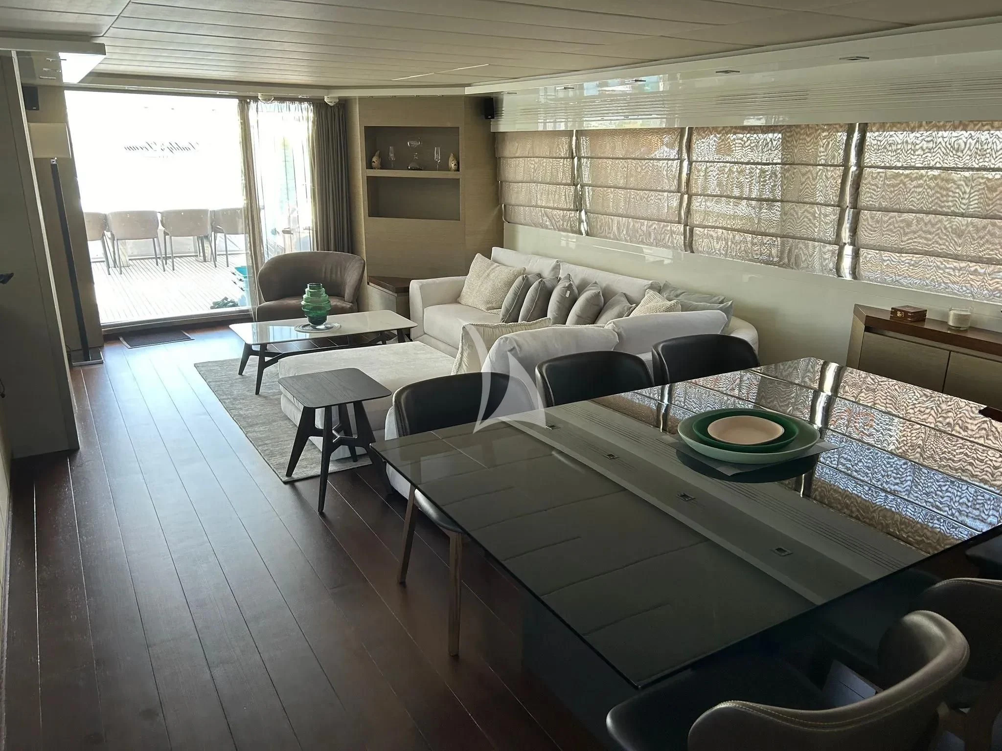 a living room with a table and chairs aboard DADDY'S DREAM 888 Yacht for Charter