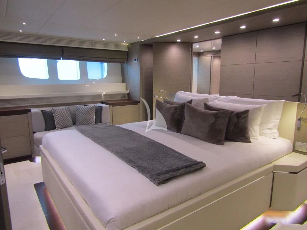 a room with a bed and a window aboard DADDY'S DREAM 888 Yacht for Charter