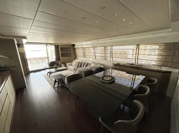 a living room with a large window aboard DADDY'S DREAM 888 Yacht for Charter