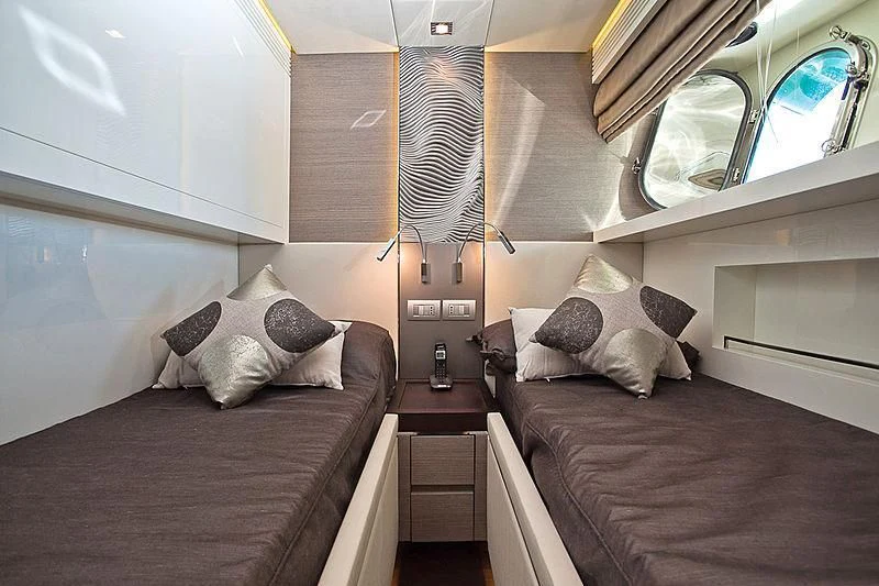 a room with two beds aboard DADDY'S DREAM 888 Yacht for Charter