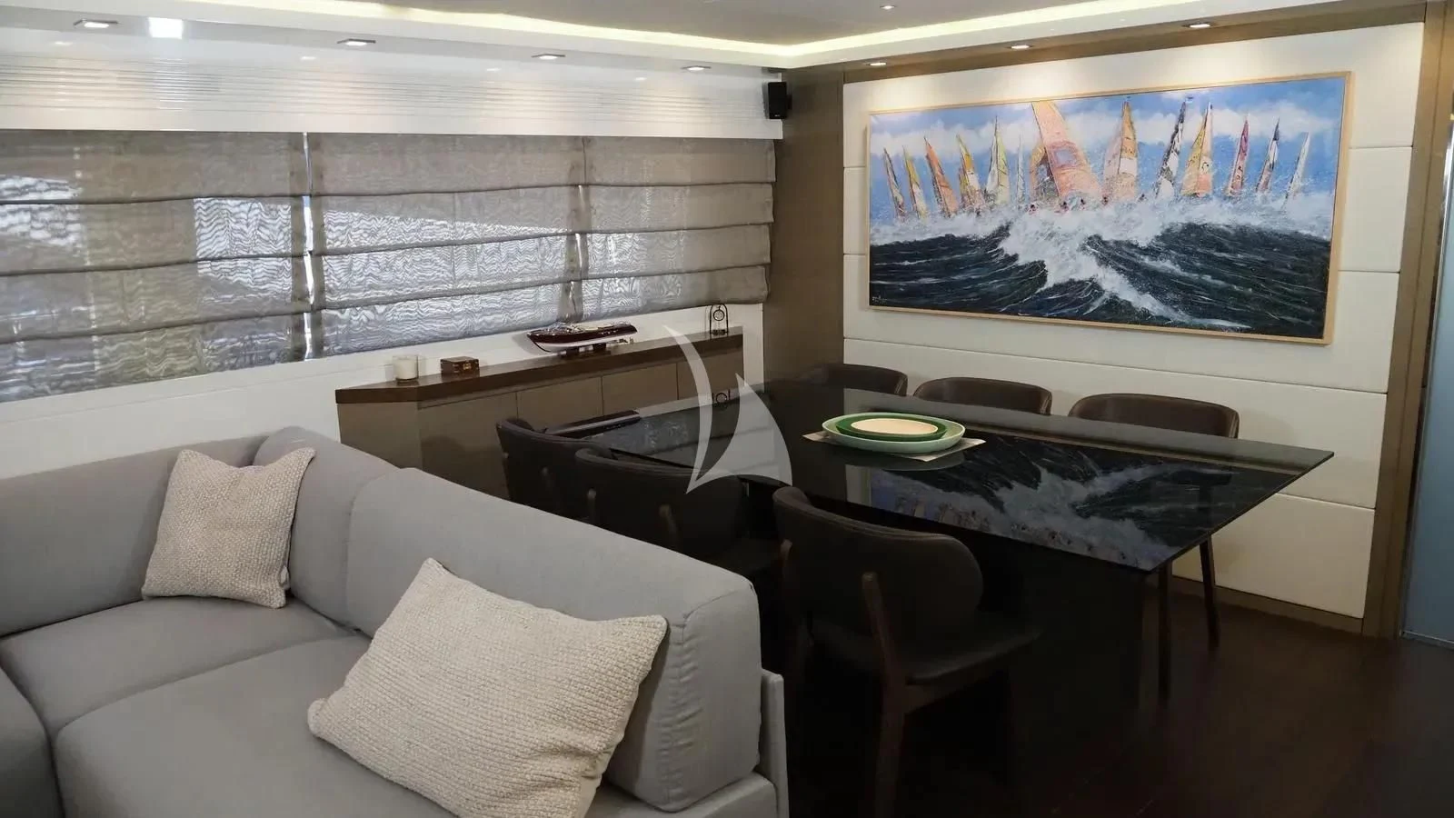 a living room with a couch and a table aboard DADDY'S DREAM 888 Yacht for Charter