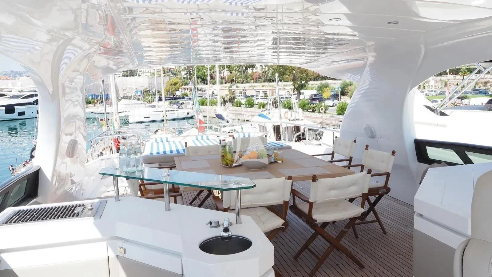 a room with a table and chairs aboard DADDY'S DREAM 888 Yacht for Charter