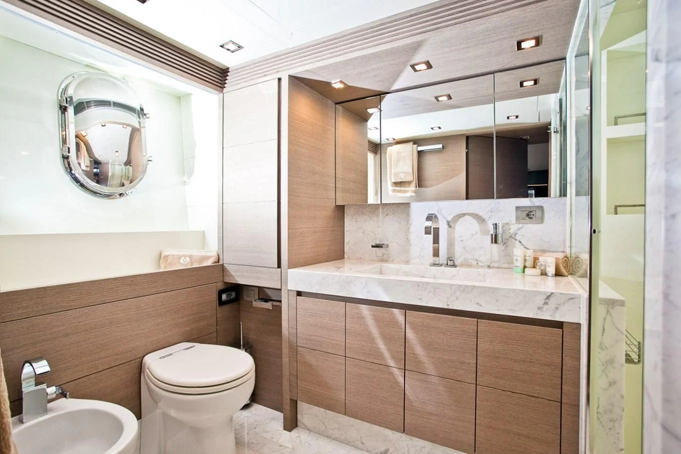 a bathroom with a large mirror aboard DADDY'S DREAM 888 Yacht for Charter