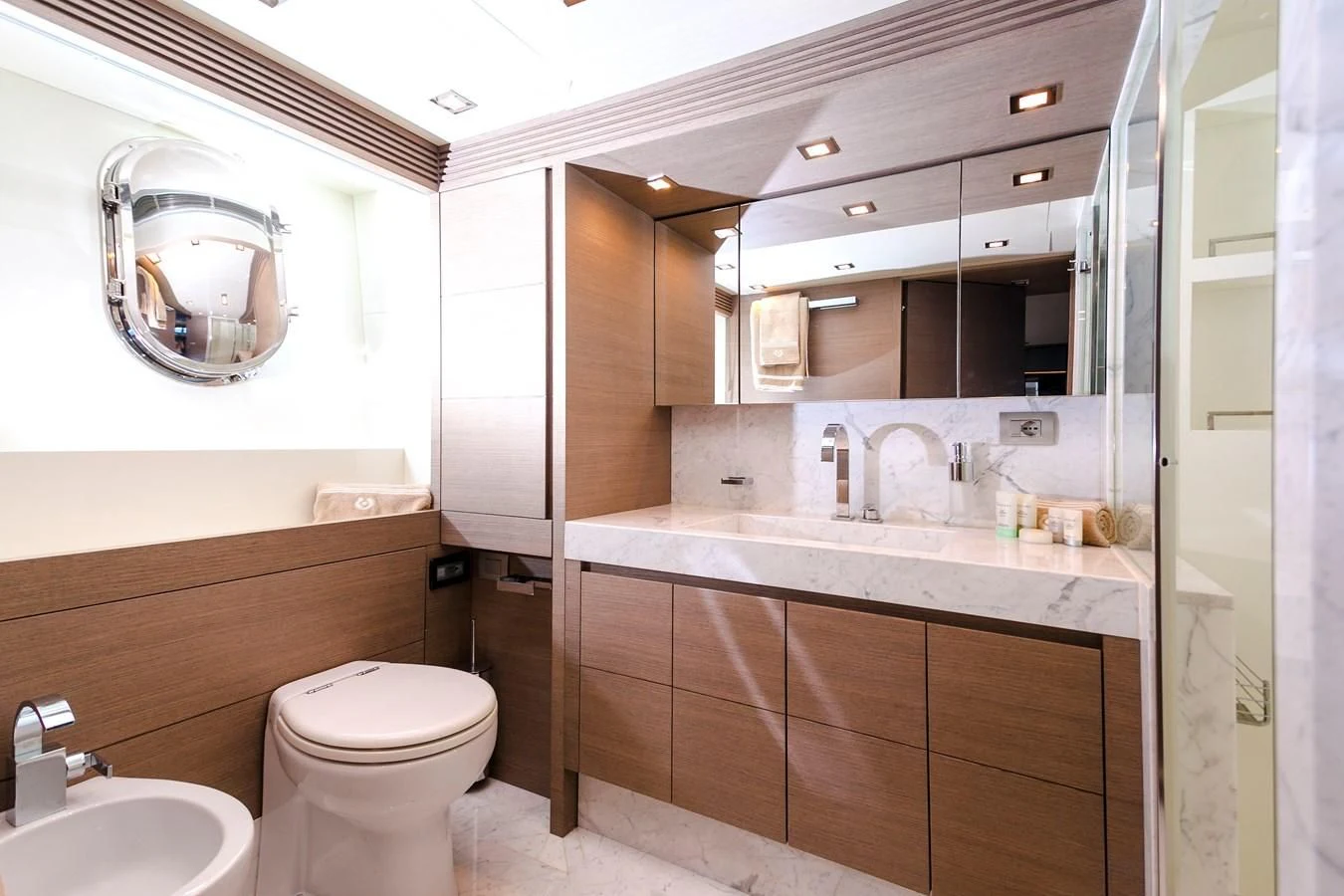 a bathroom with a large mirror aboard DADDY'S DREAM 888 Yacht for Charter