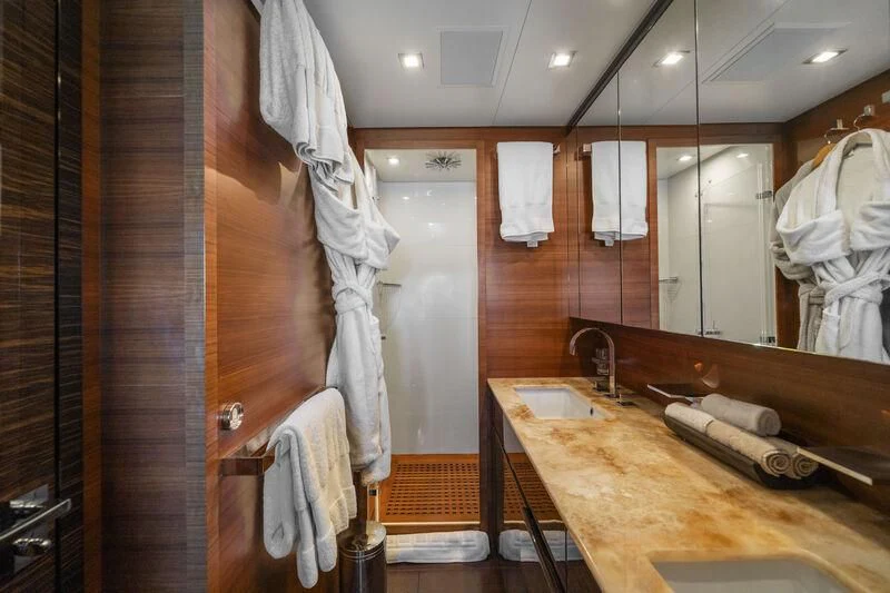 a bathroom with a countertop sink and a mirror aboard ECLAT Yacht for Sale