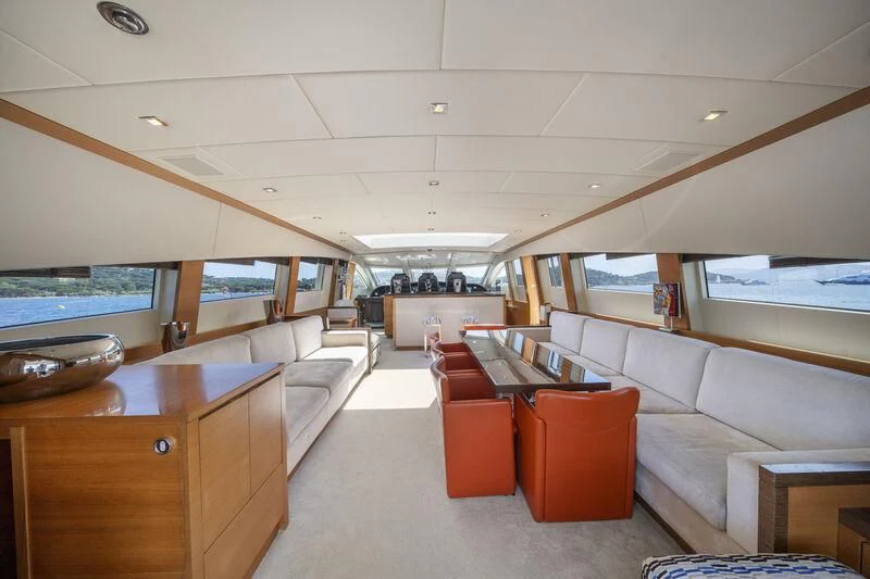 a room with a couch and a table aboard ECLAT Yacht for Sale