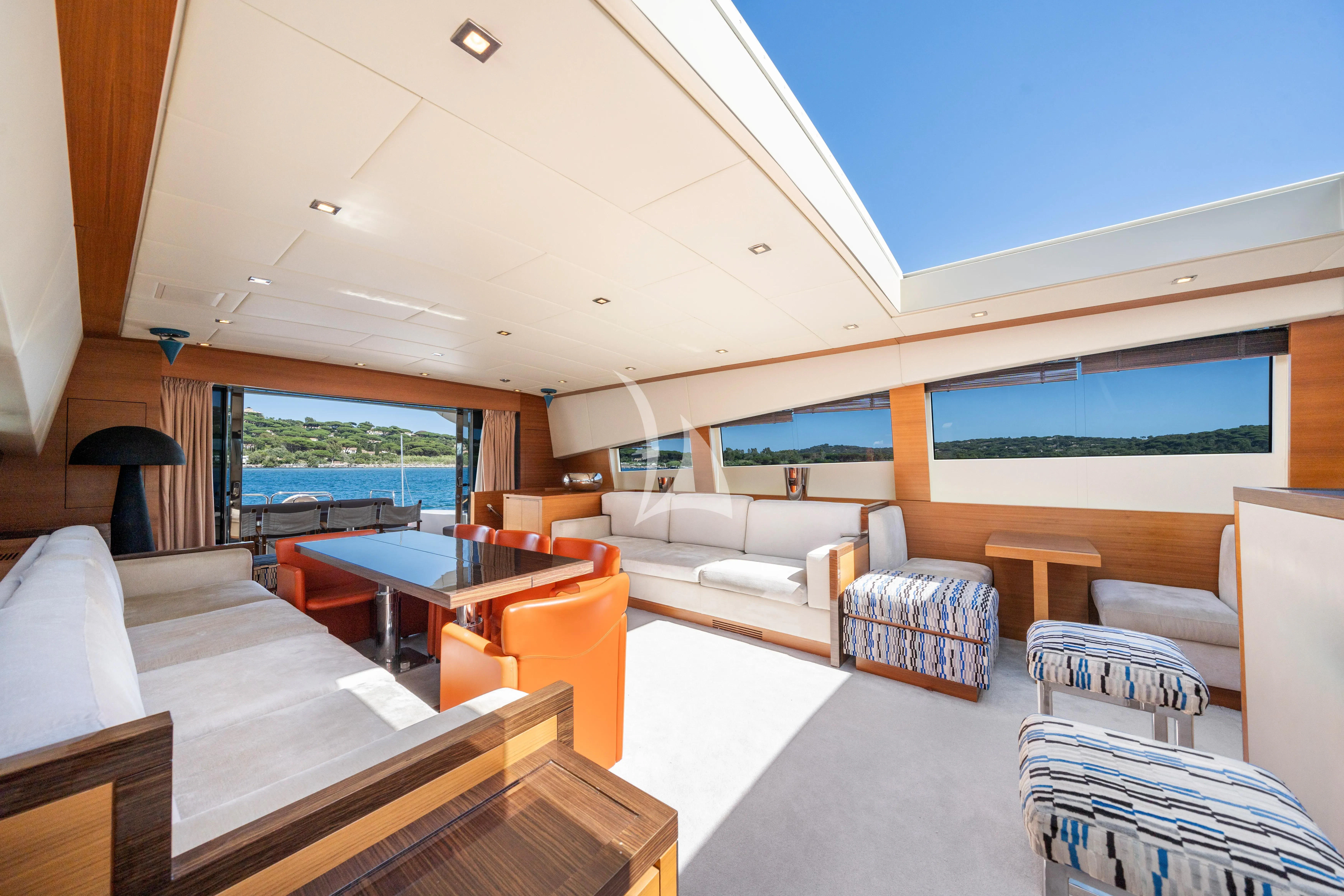 a living room with a large window aboard ECLAT Yacht for Sale