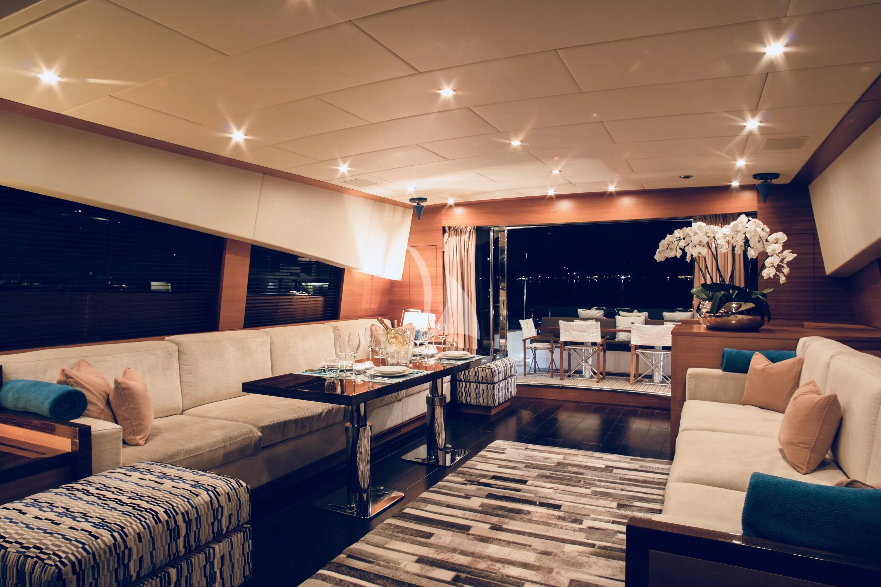 a living room with a large screen aboard ECLAT Yacht for Sale