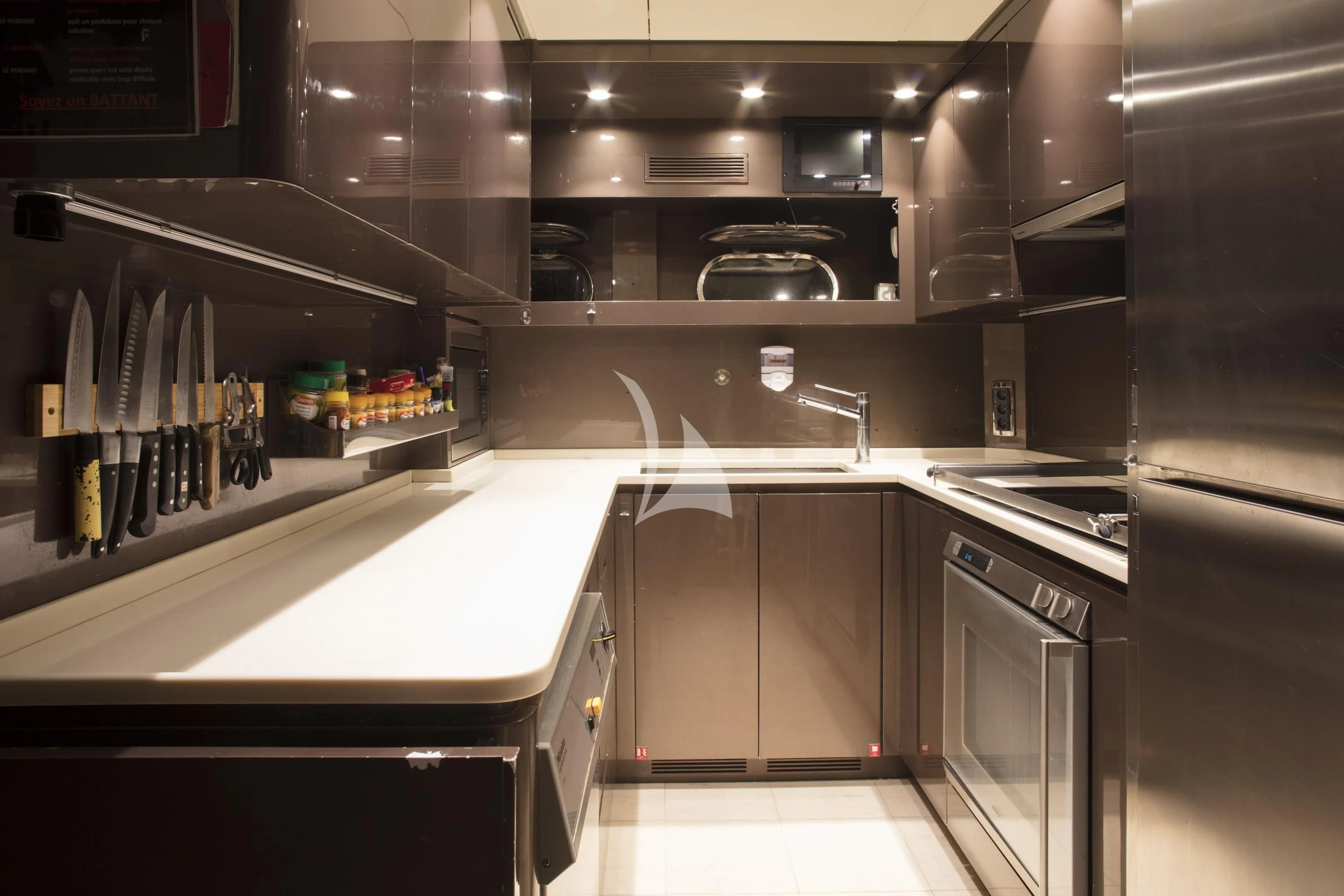 a kitchen with stainless steel appliances aboard ECLAT Yacht for Sale