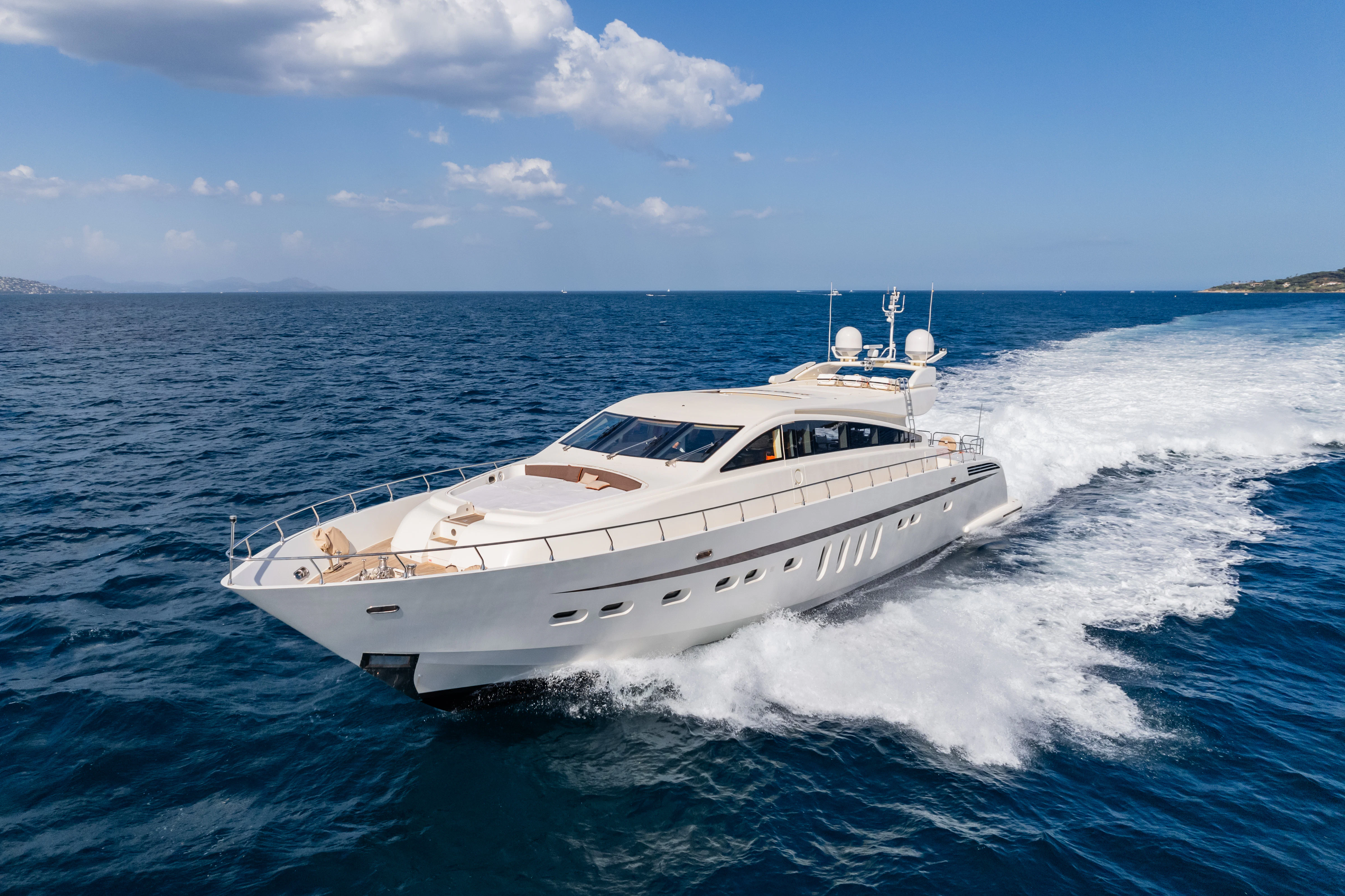 a white yacht on the water aboard ECLAT Yacht for Sale