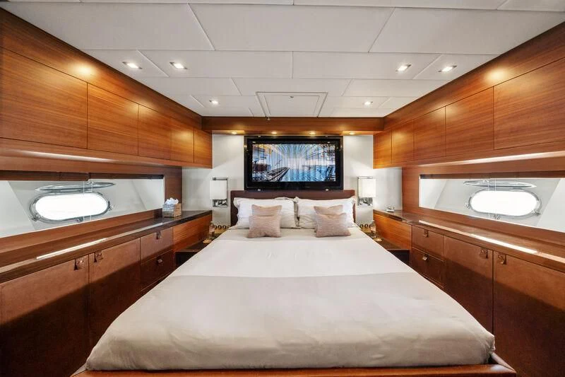 a room with a bed and a television aboard ECLAT Yacht for Sale