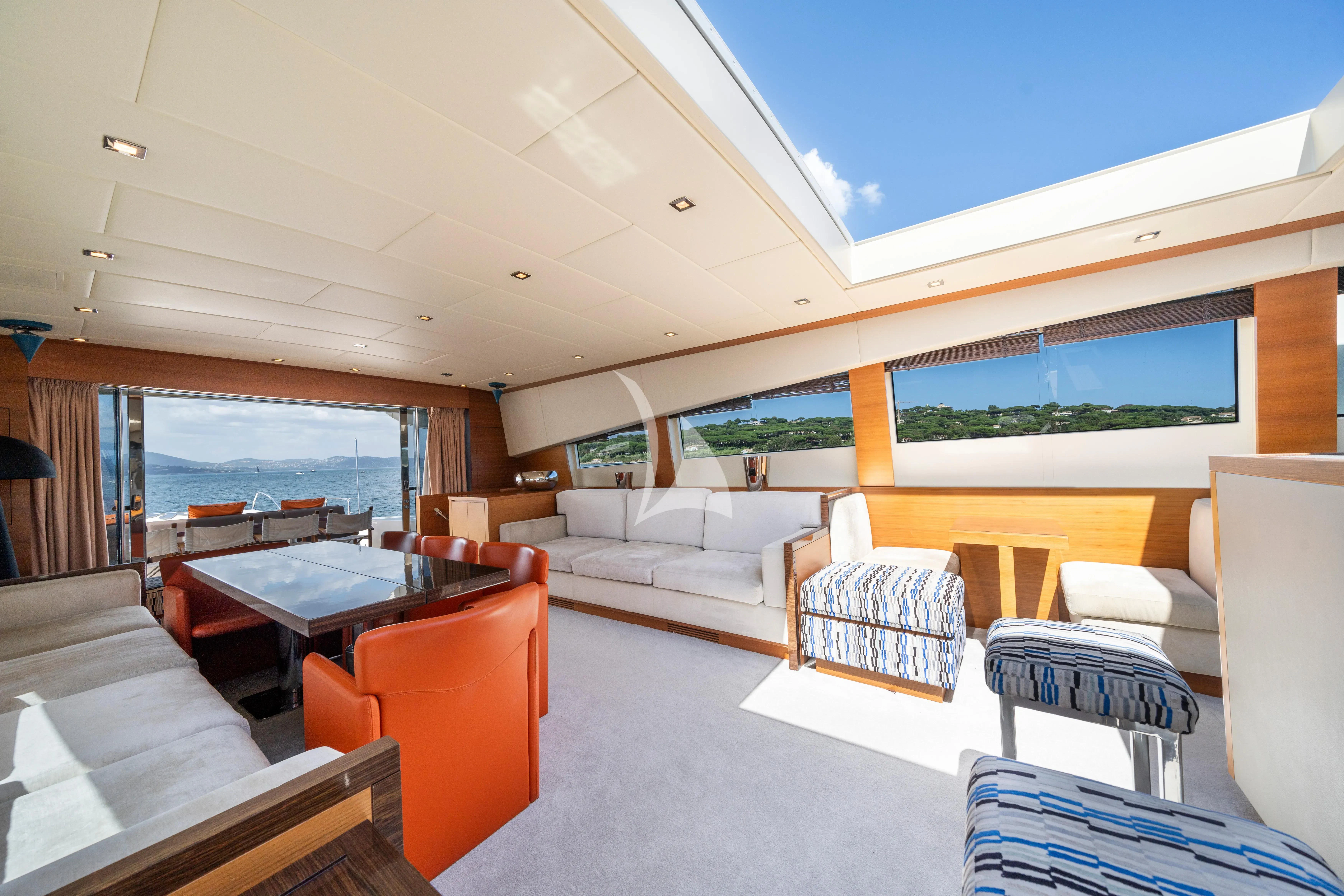 a living room with a large window aboard ECLAT Yacht for Sale