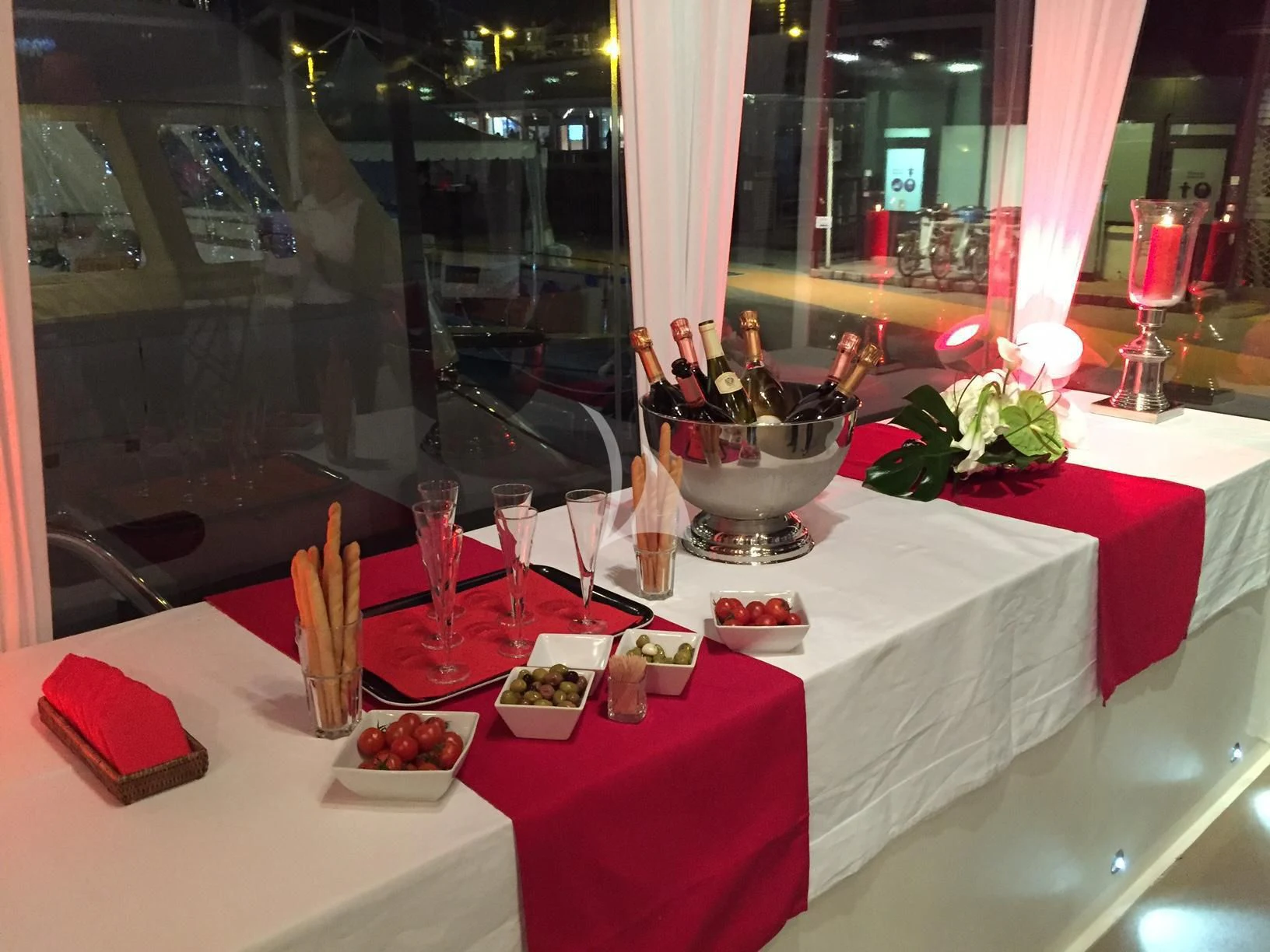 a table with food and drinks aboard ECLAT Yacht for Sale