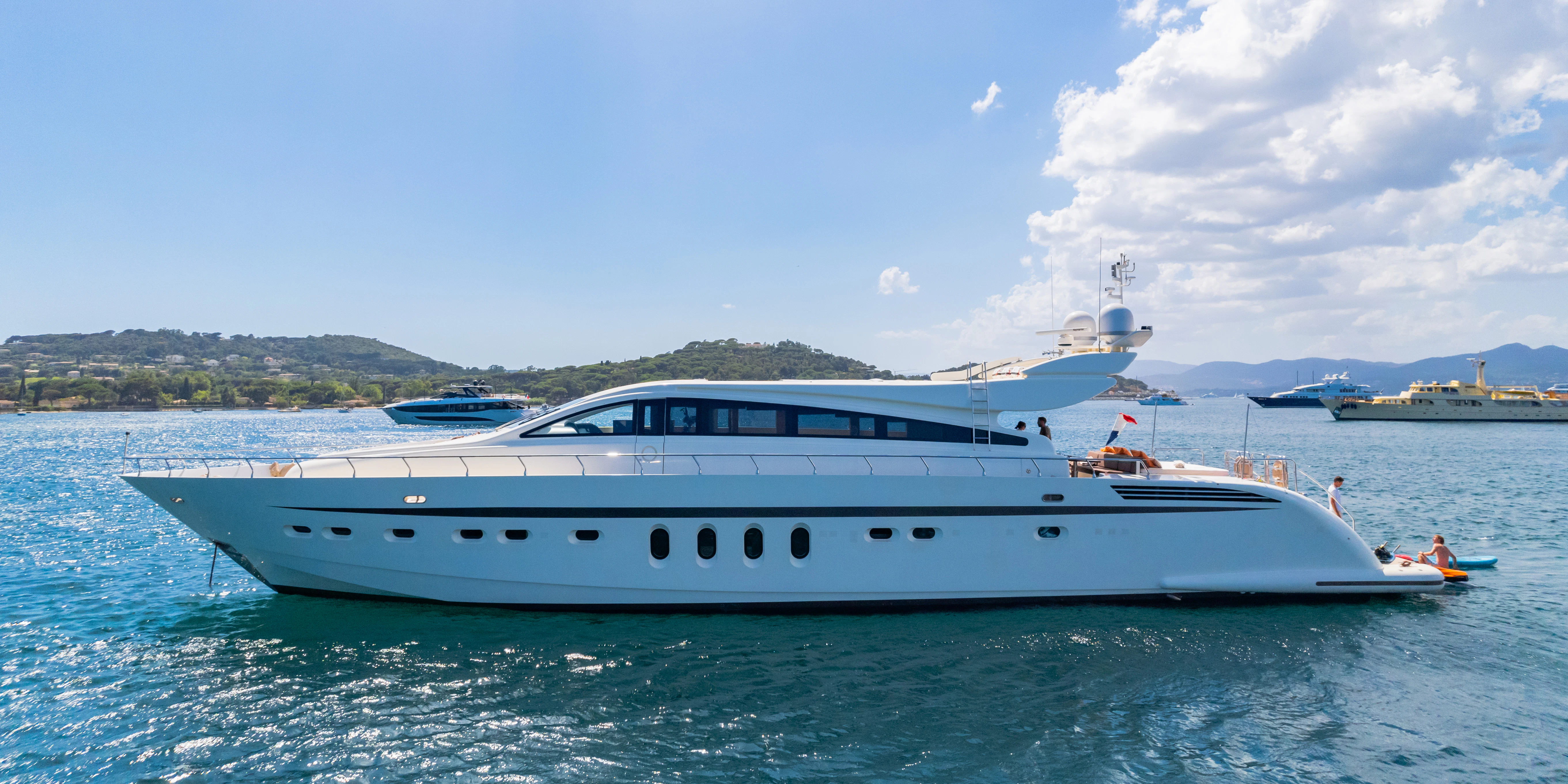 a white yacht in the water aboard ECLAT Yacht for Sale