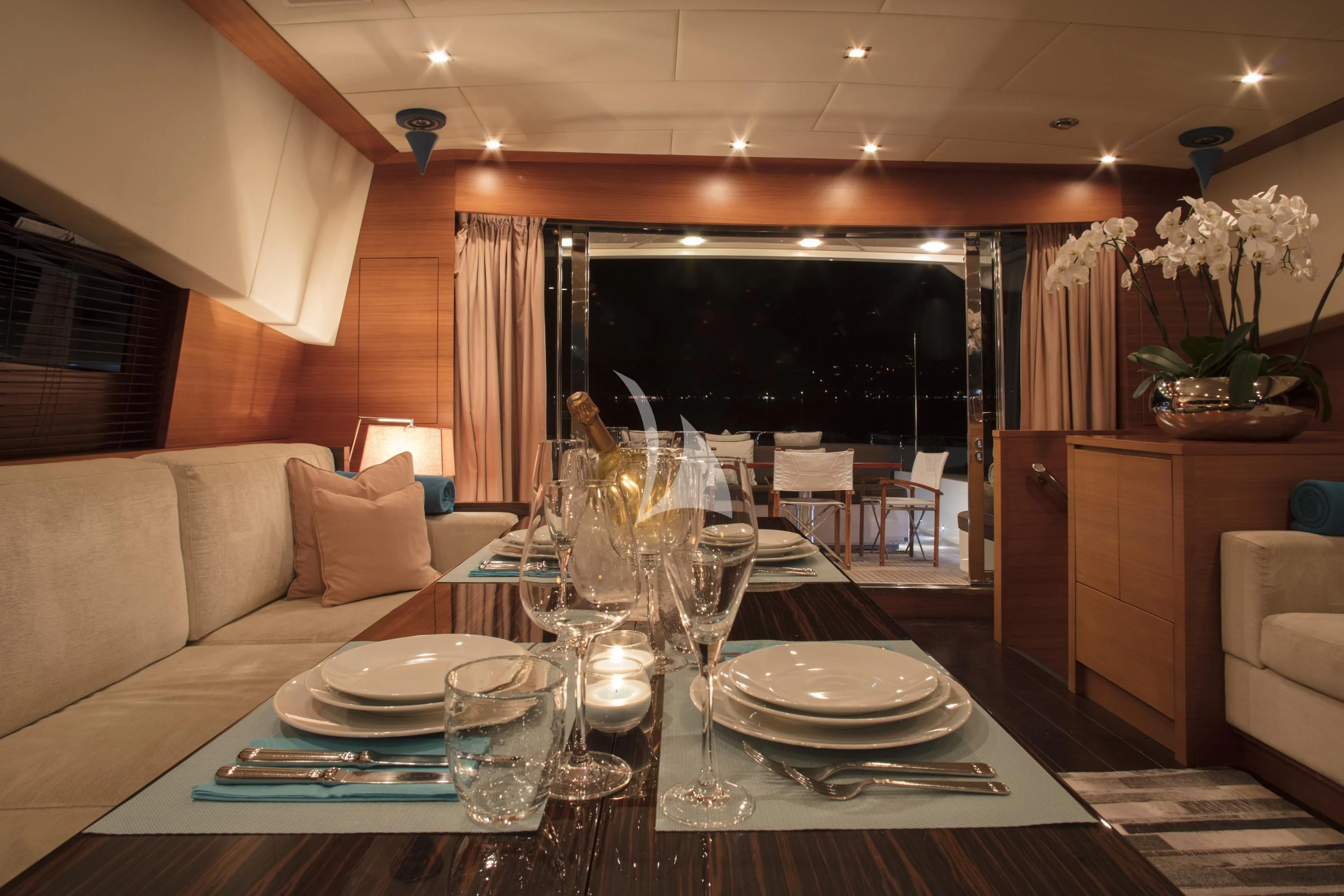 a table with plates and glasses on it aboard ECLAT Yacht for Sale