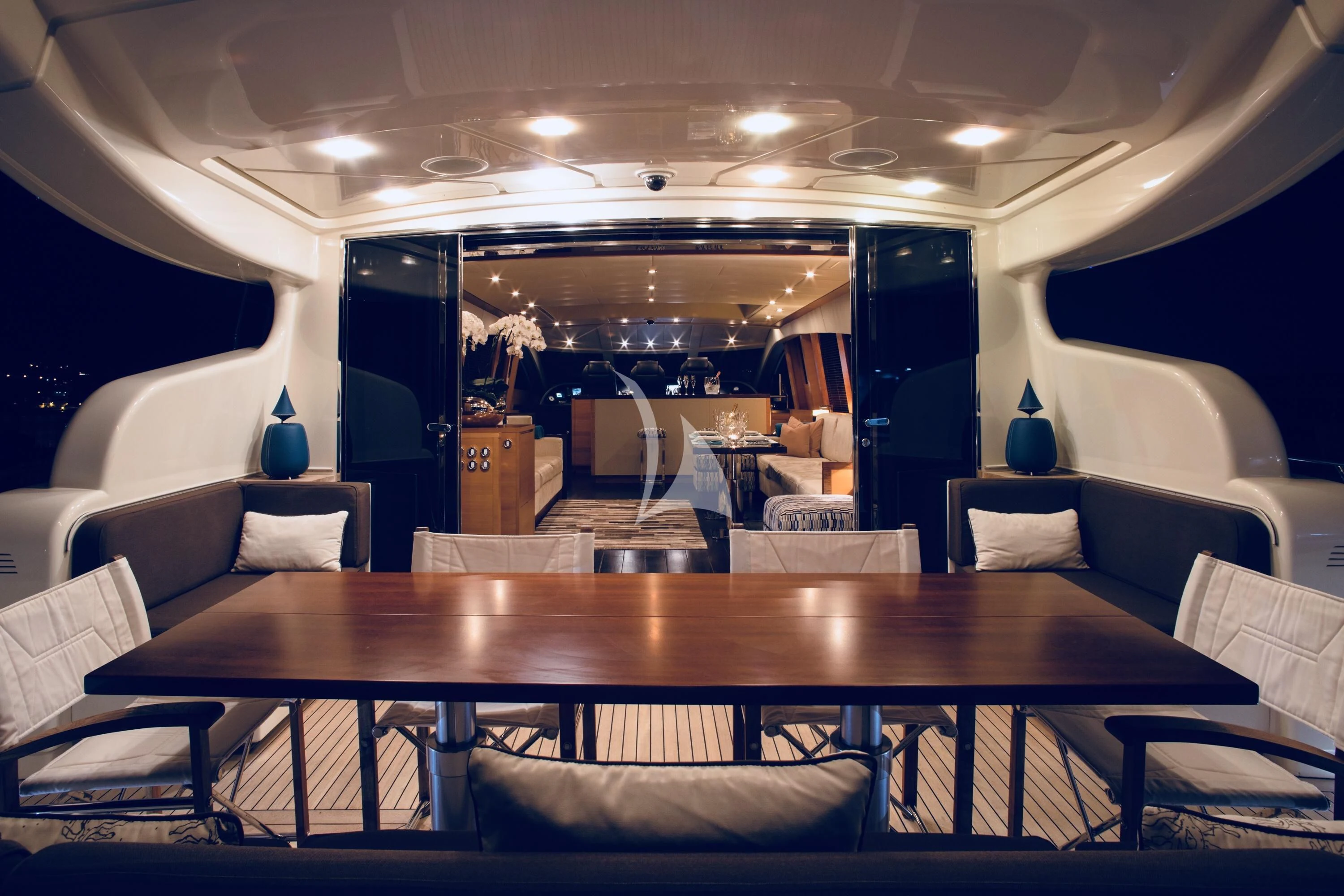 a large room with a table and chairs aboard ECLAT Yacht for Sale