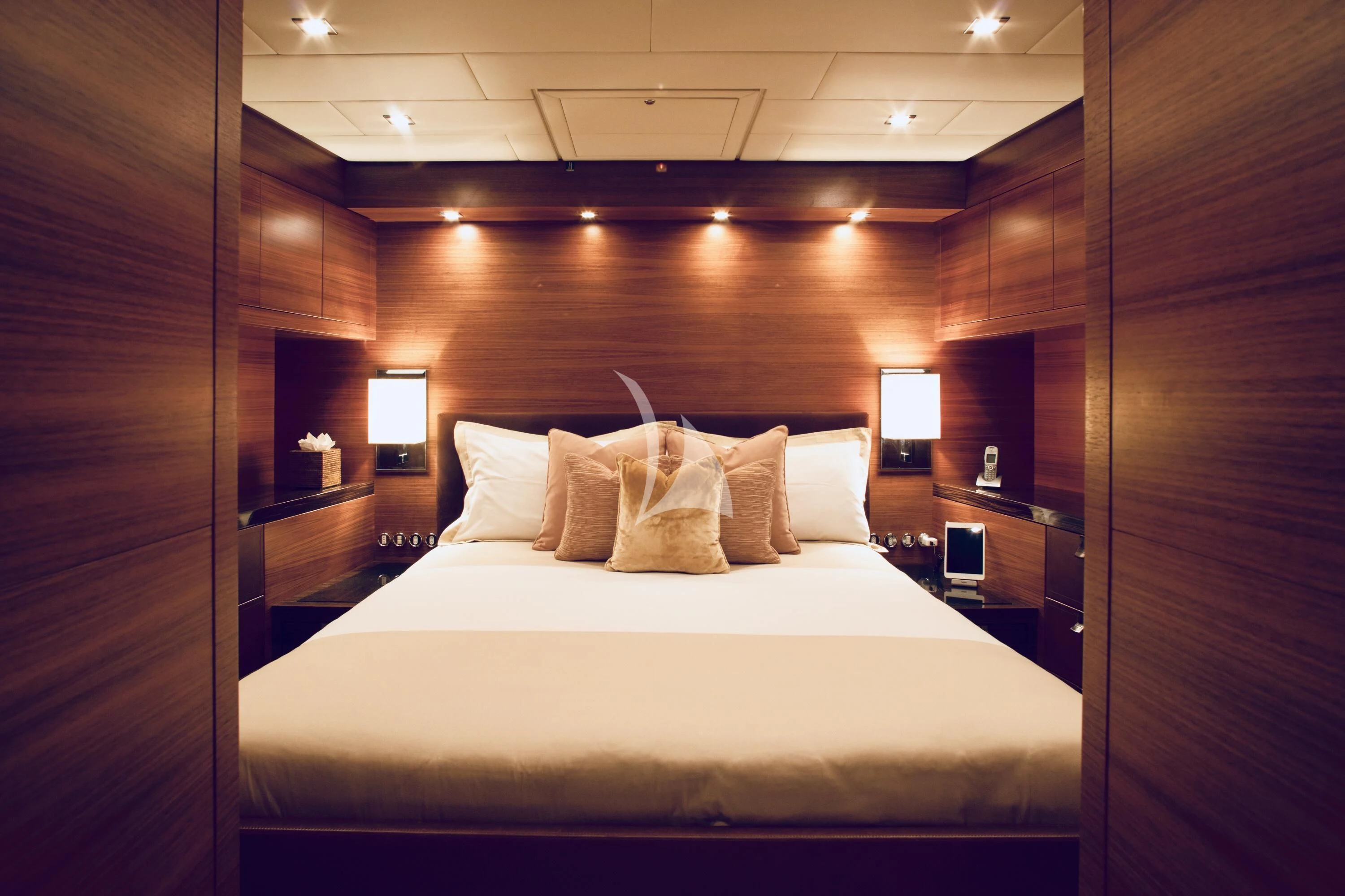 a bed with white sheets aboard ECLAT Yacht for Sale