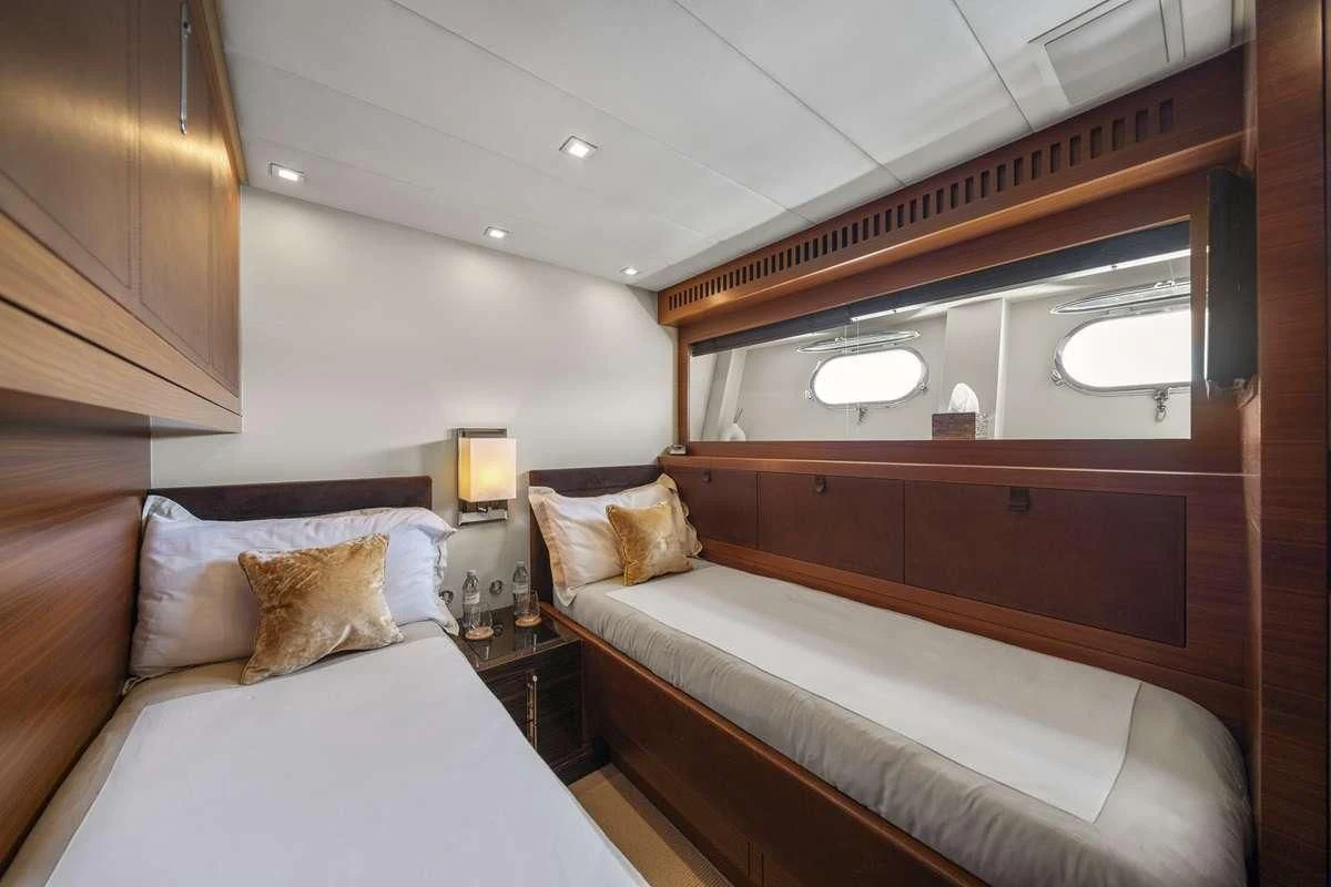 a room with two beds aboard ECLAT Yacht for Sale
