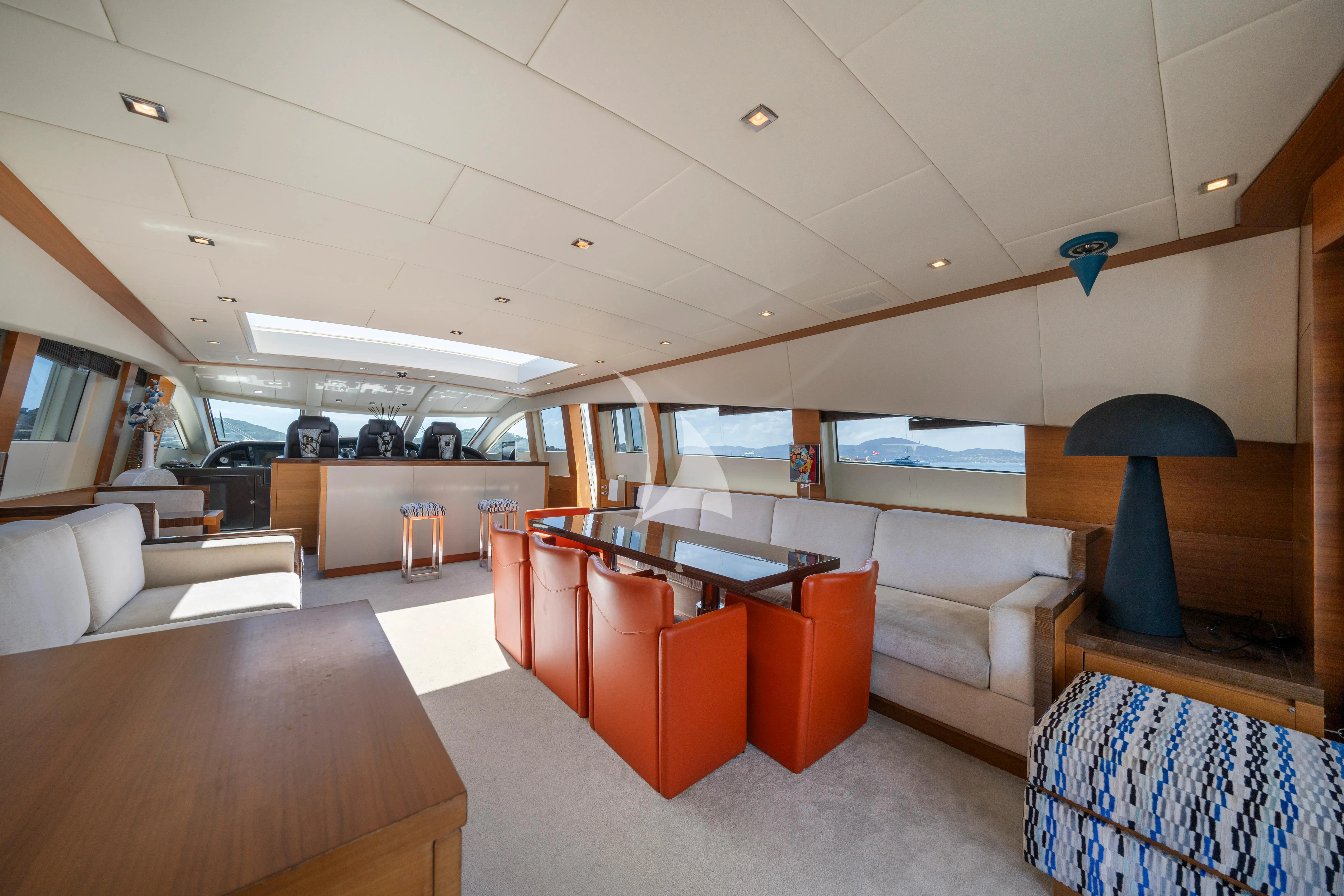 a room with a couch and a table aboard ECLAT Yacht for Sale