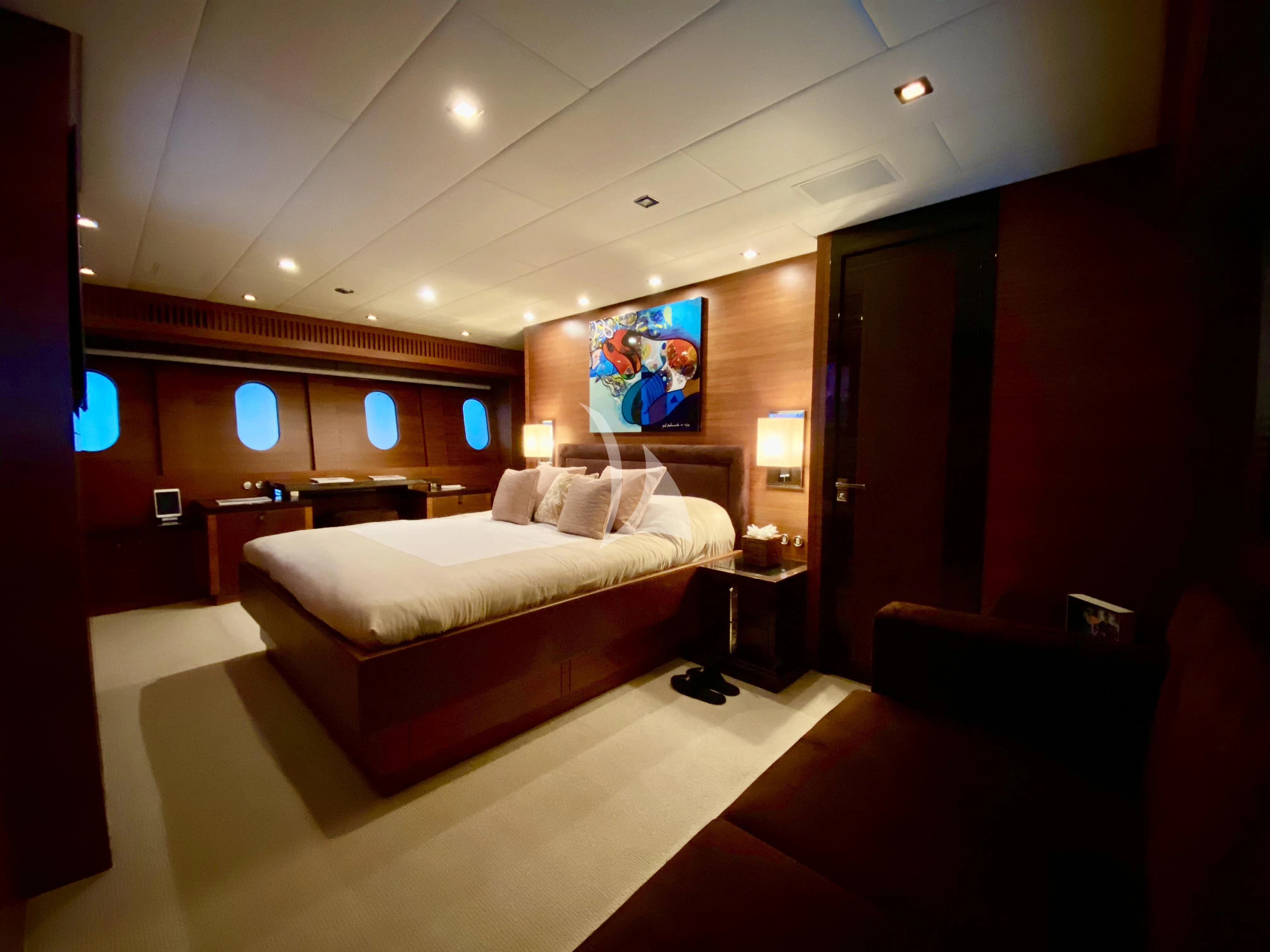 a room with a bed and a couch aboard ECLAT Yacht for Sale