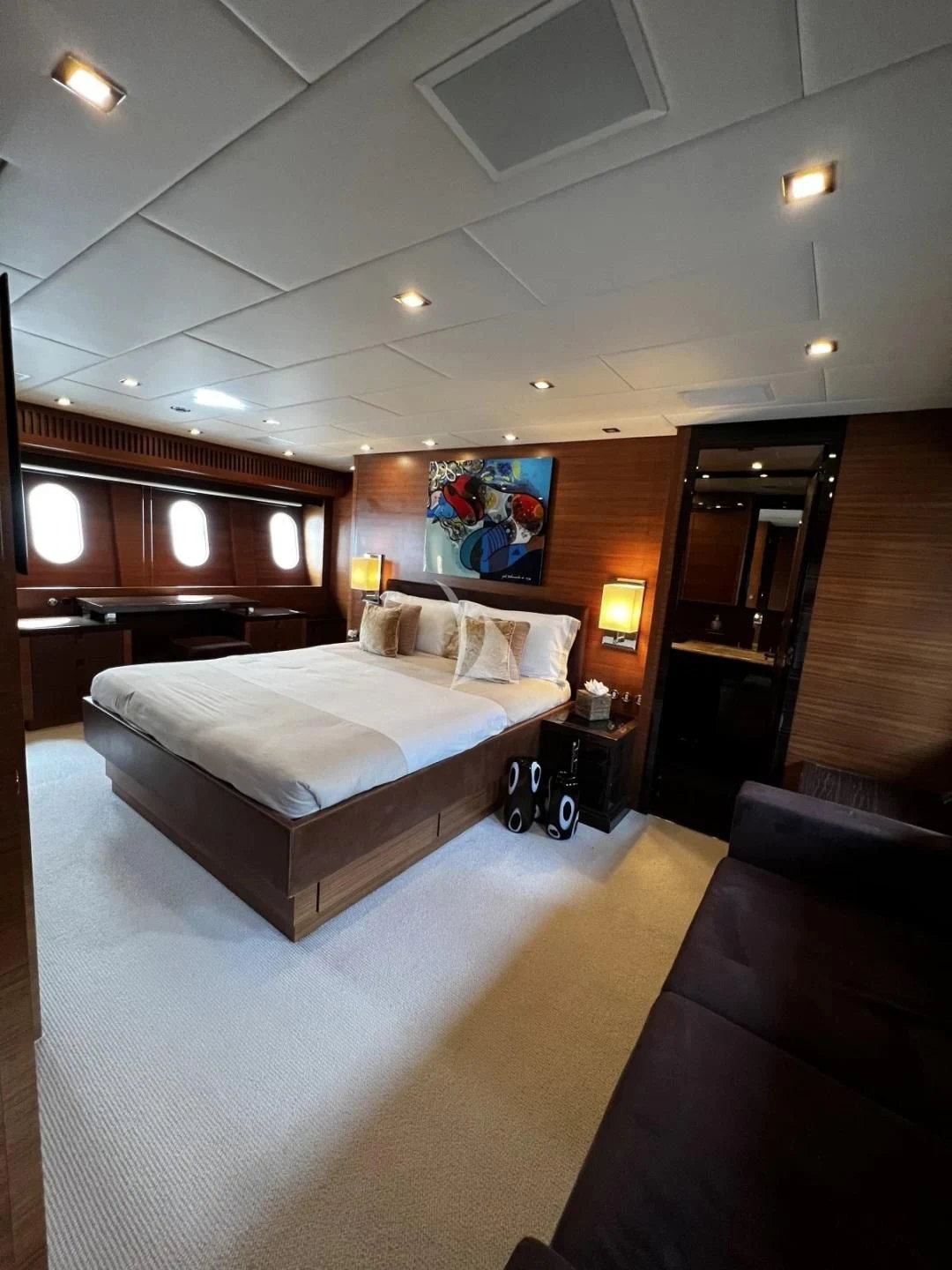 a room with a bed and a piano aboard ECLAT Yacht for Sale