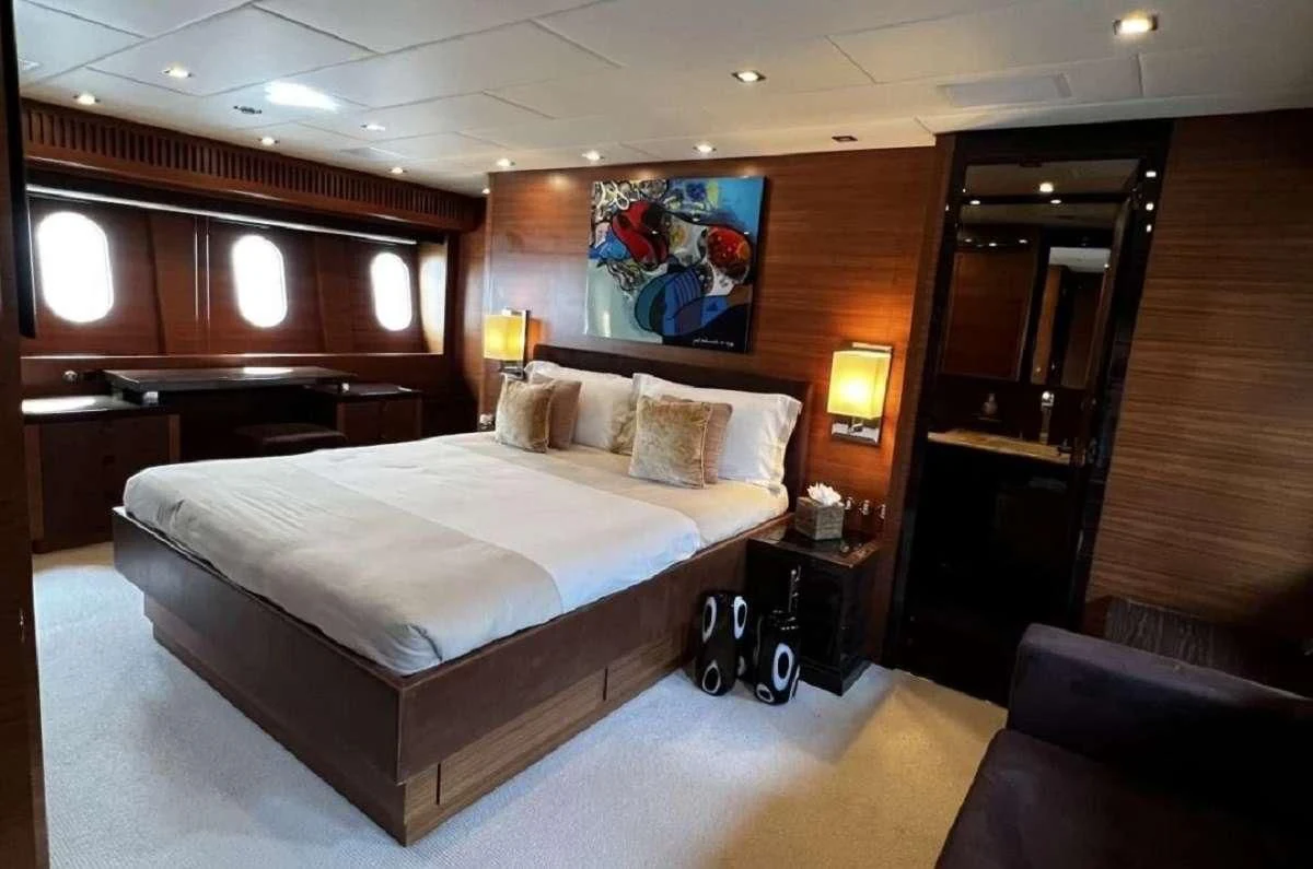 a bed in a room aboard ECLAT Yacht for Sale