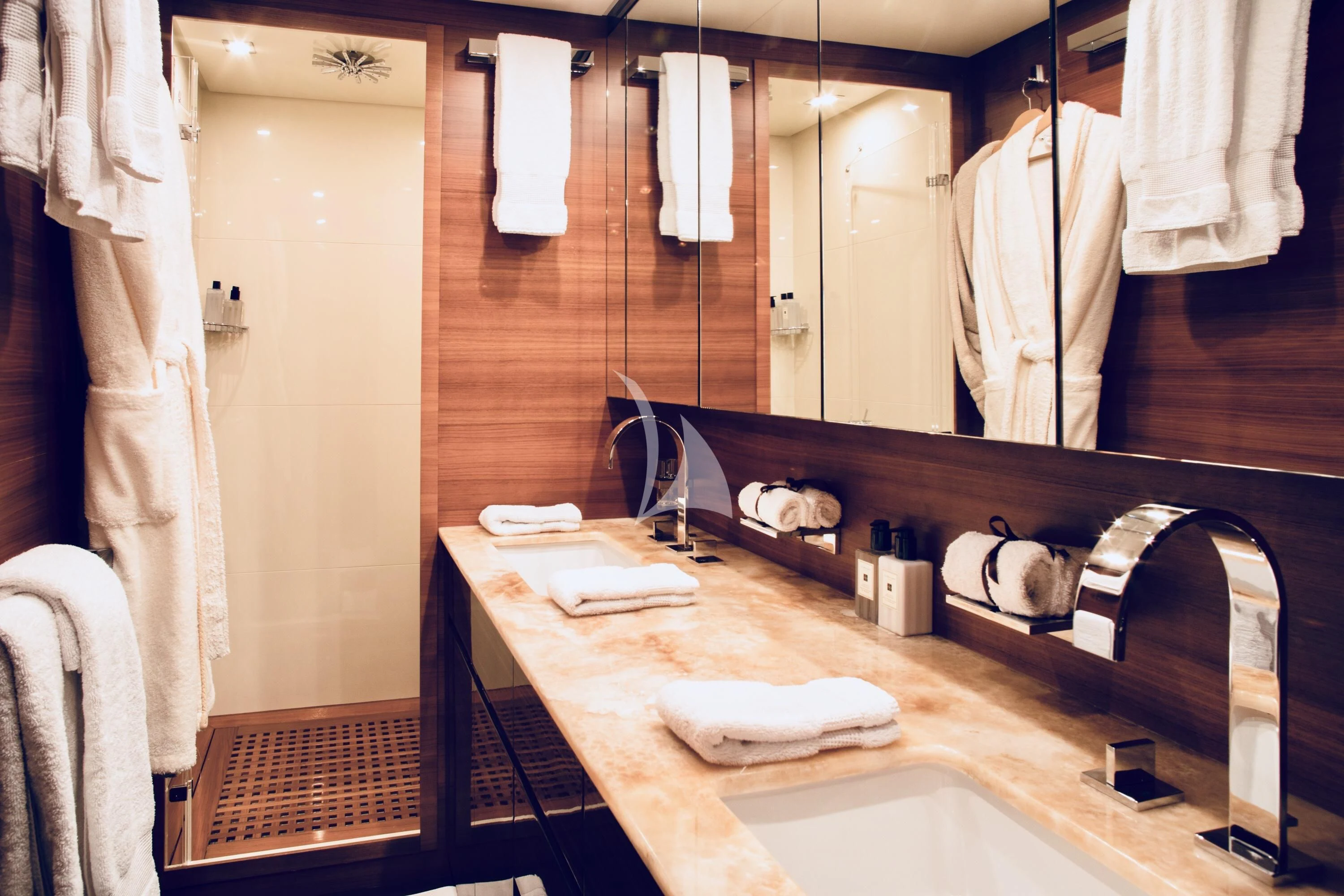 a bathroom with a large mirror aboard ECLAT Yacht for Sale