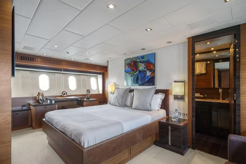 a bedroom with a large bed aboard ECLAT Yacht for Sale