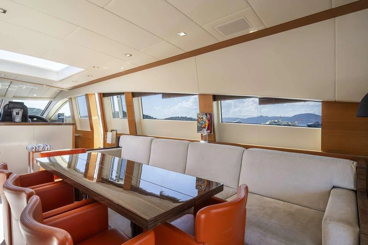 a room with a table and chairs aboard ECLAT Yacht for Sale