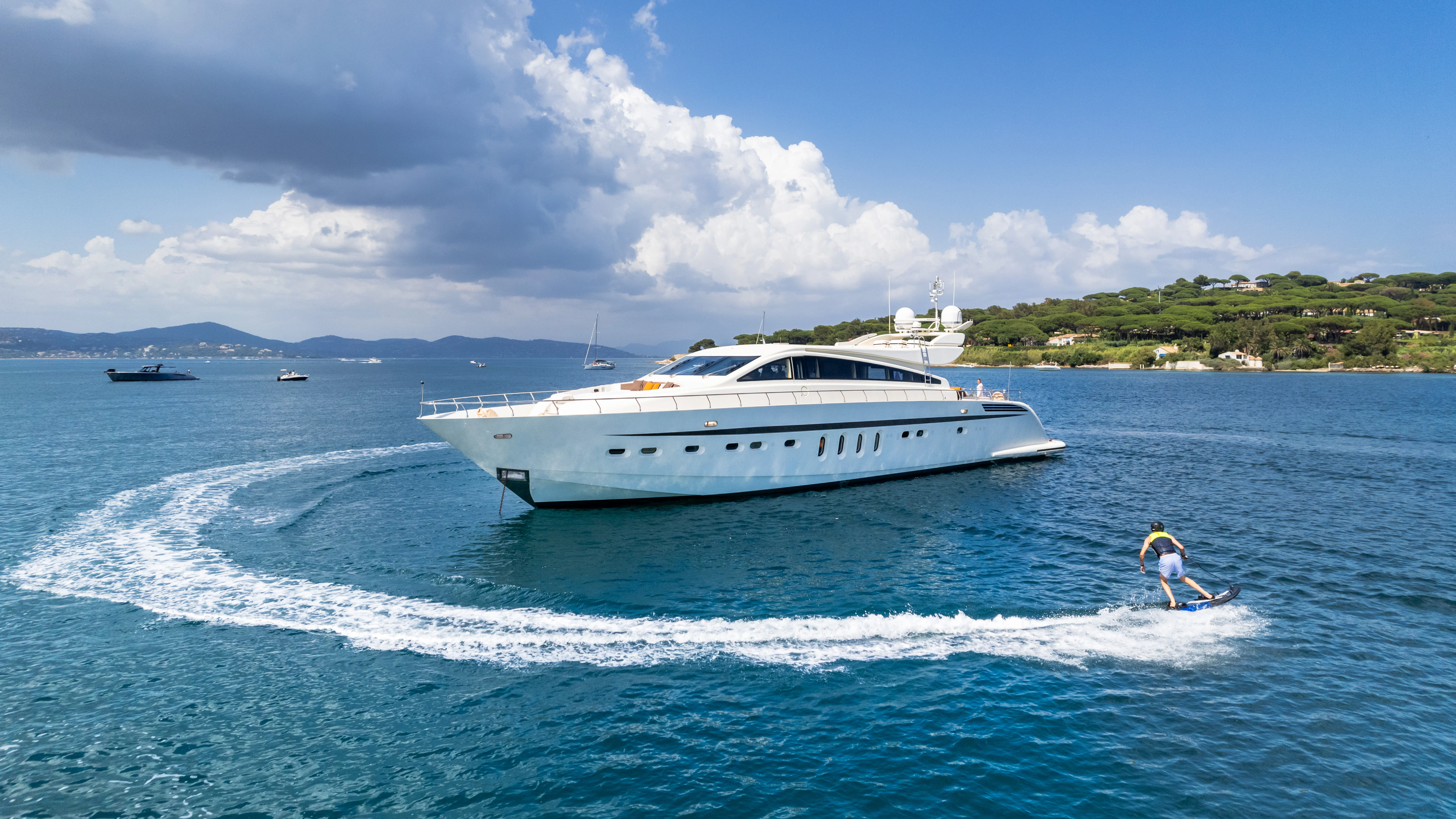 a person surfing on the water aboard ECLAT Yacht for Sale