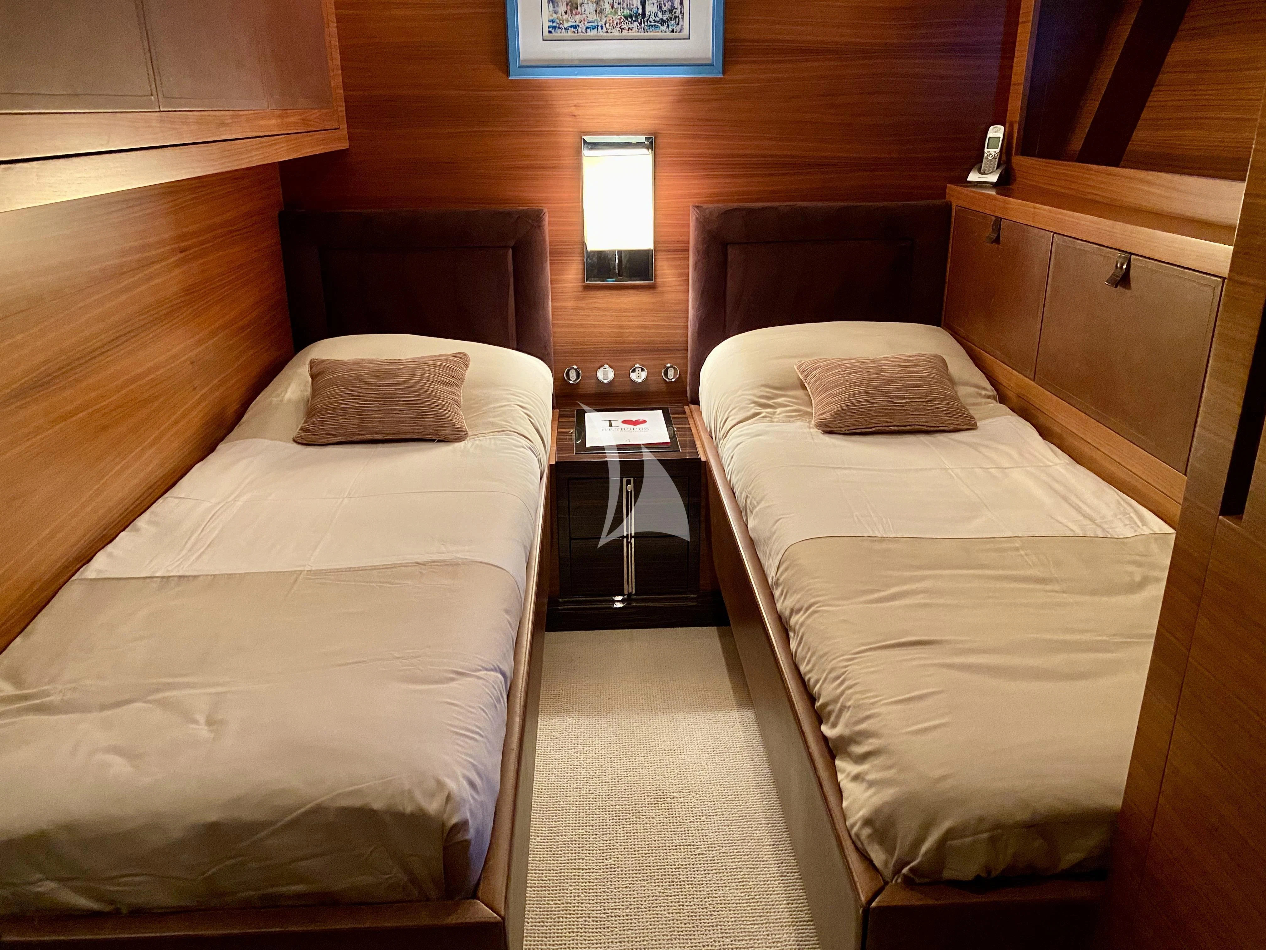 a room with two beds aboard ECLAT Yacht for Sale