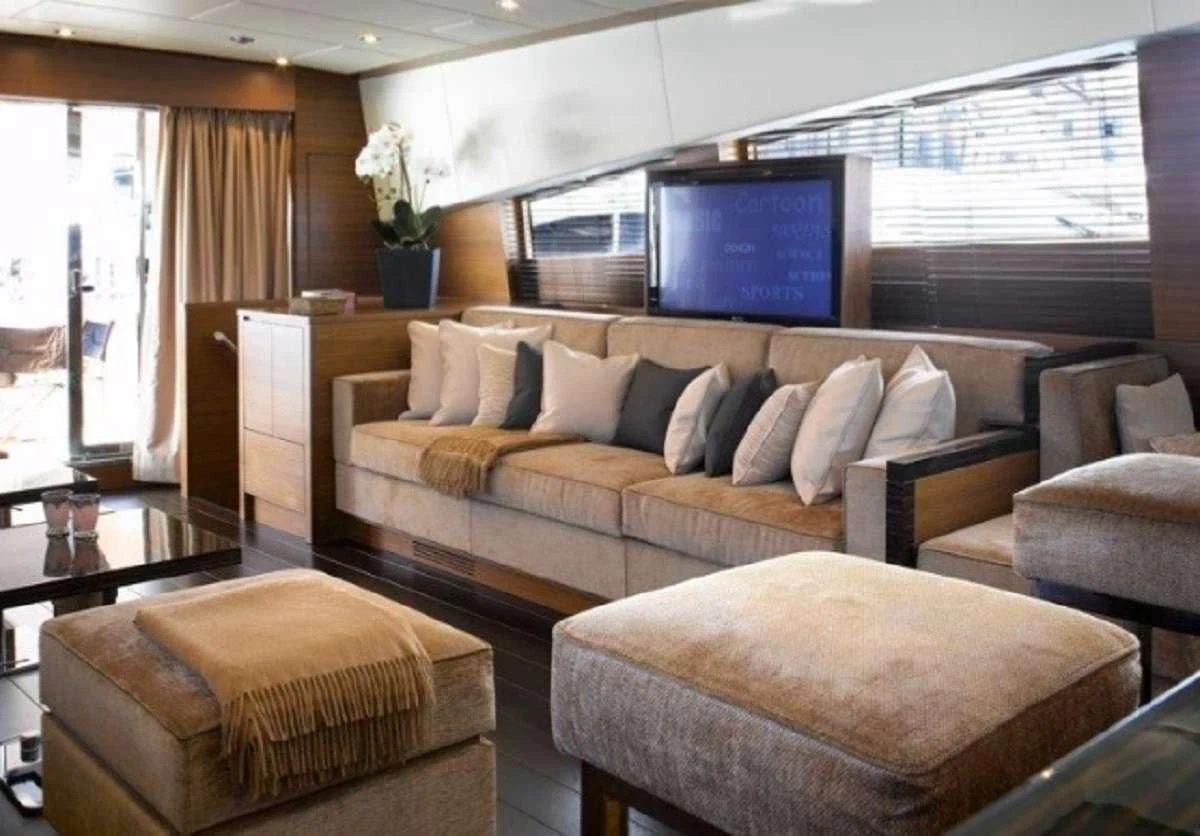 a living room with a couch and a tv aboard ECLAT Yacht for Sale