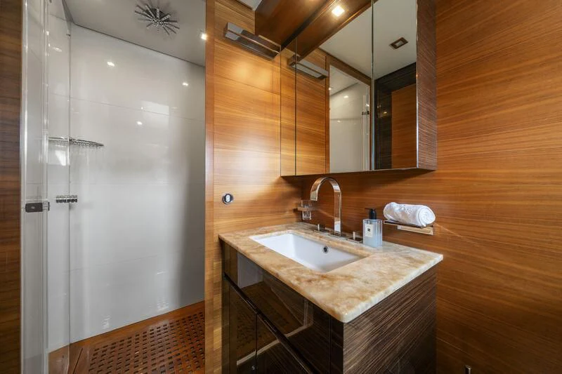 a bathroom with a sink and a shower aboard ECLAT Yacht for Sale