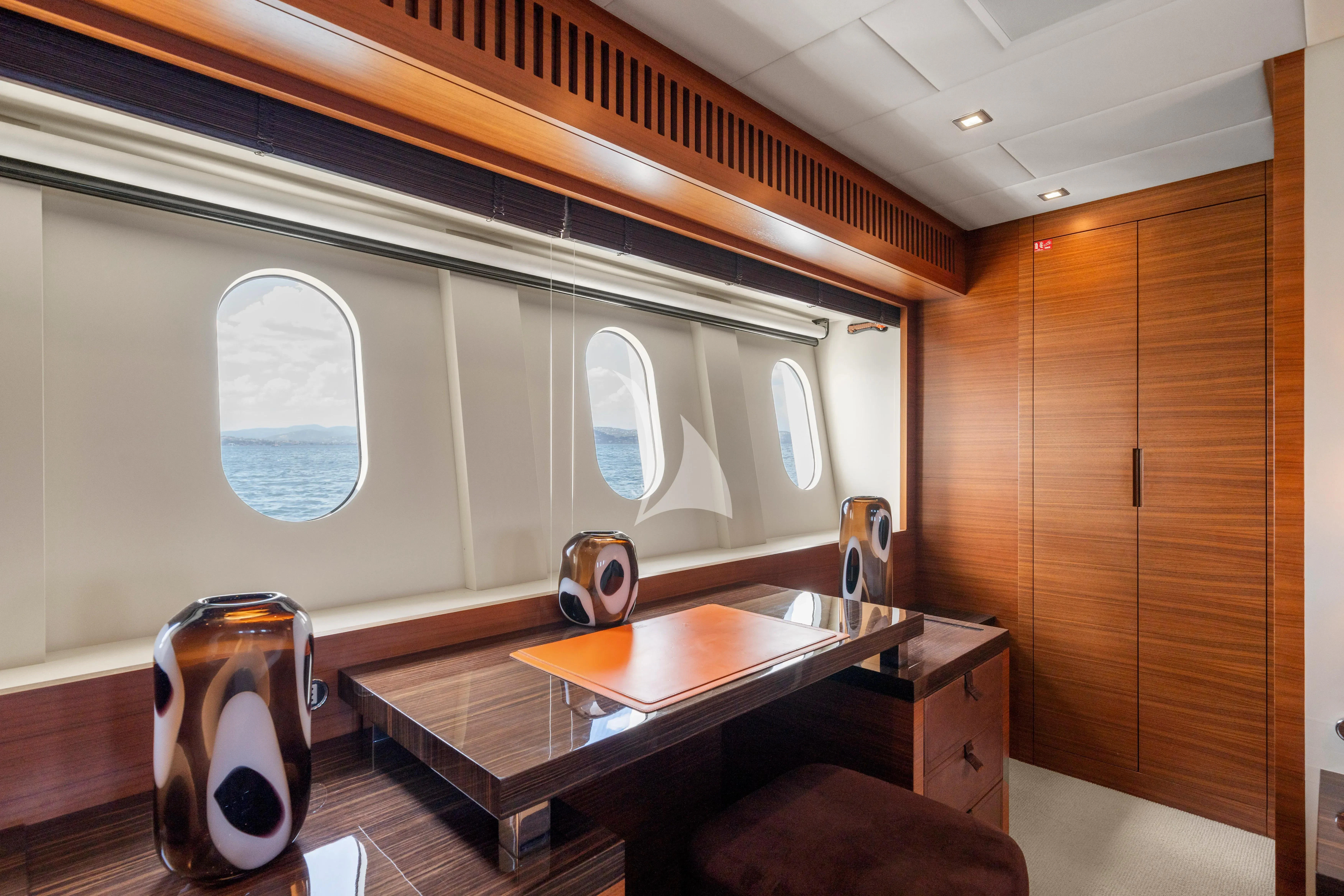 a room with a table and chairs aboard ECLAT Yacht for Sale