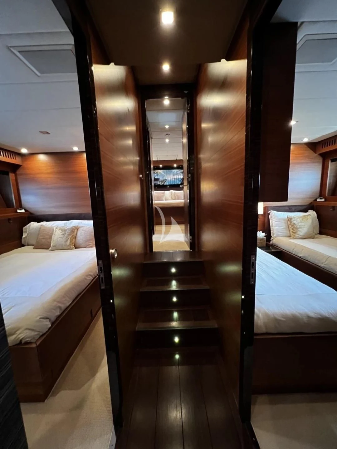 a room with a bed and a mirror aboard ECLAT Yacht for Sale