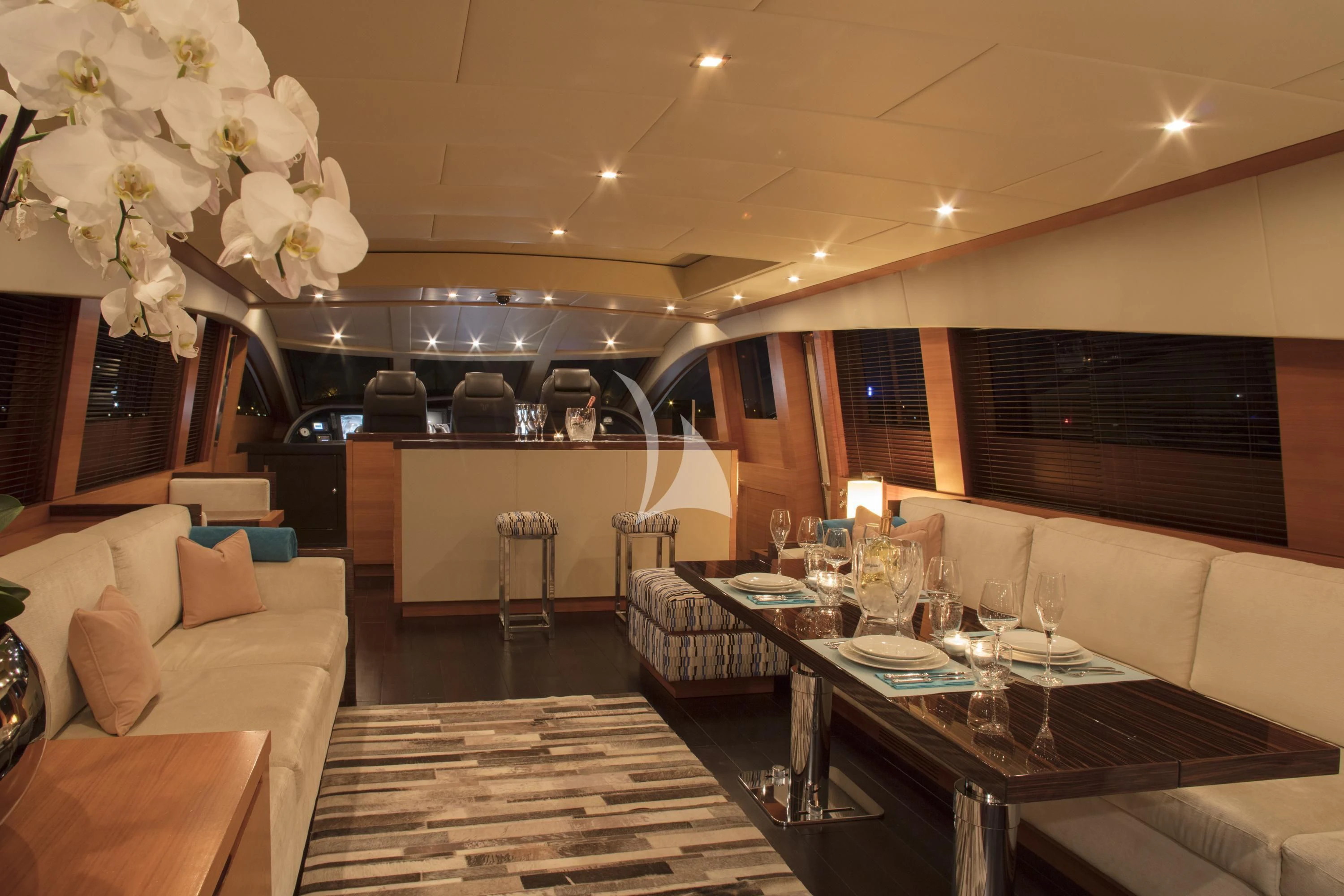 a large room with a table and chairs aboard ECLAT Yacht for Sale