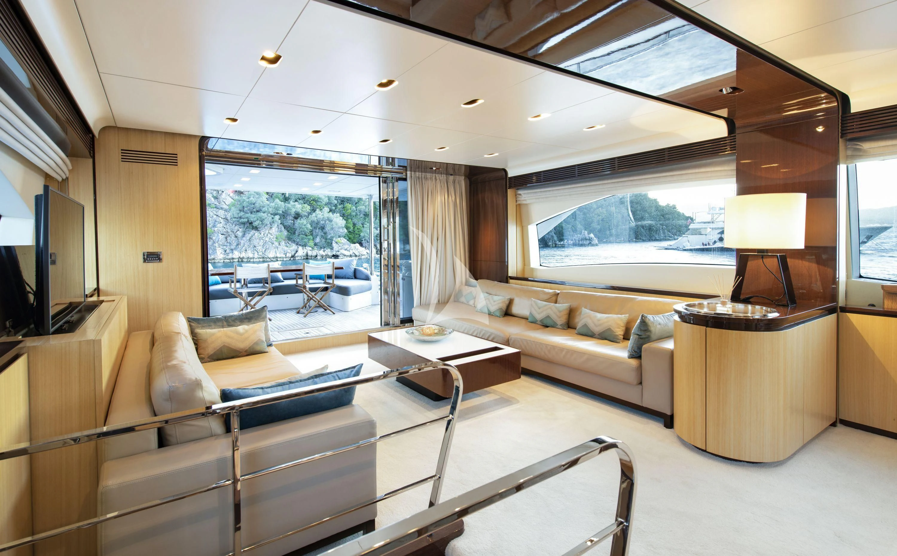 a living room with a large window aboard HUBO Yacht for Sale