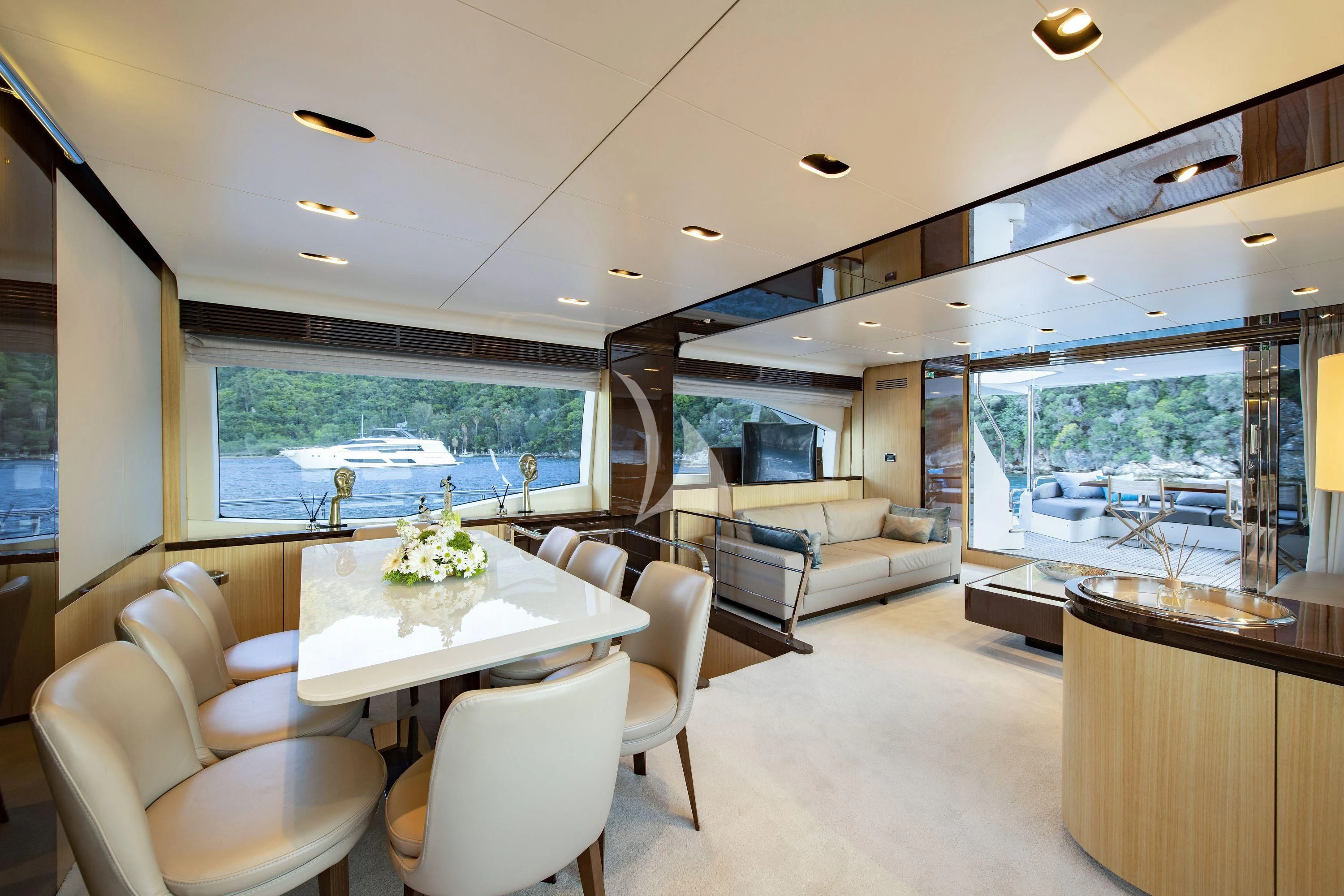 a living room with a large window aboard HUBO Yacht for Sale
