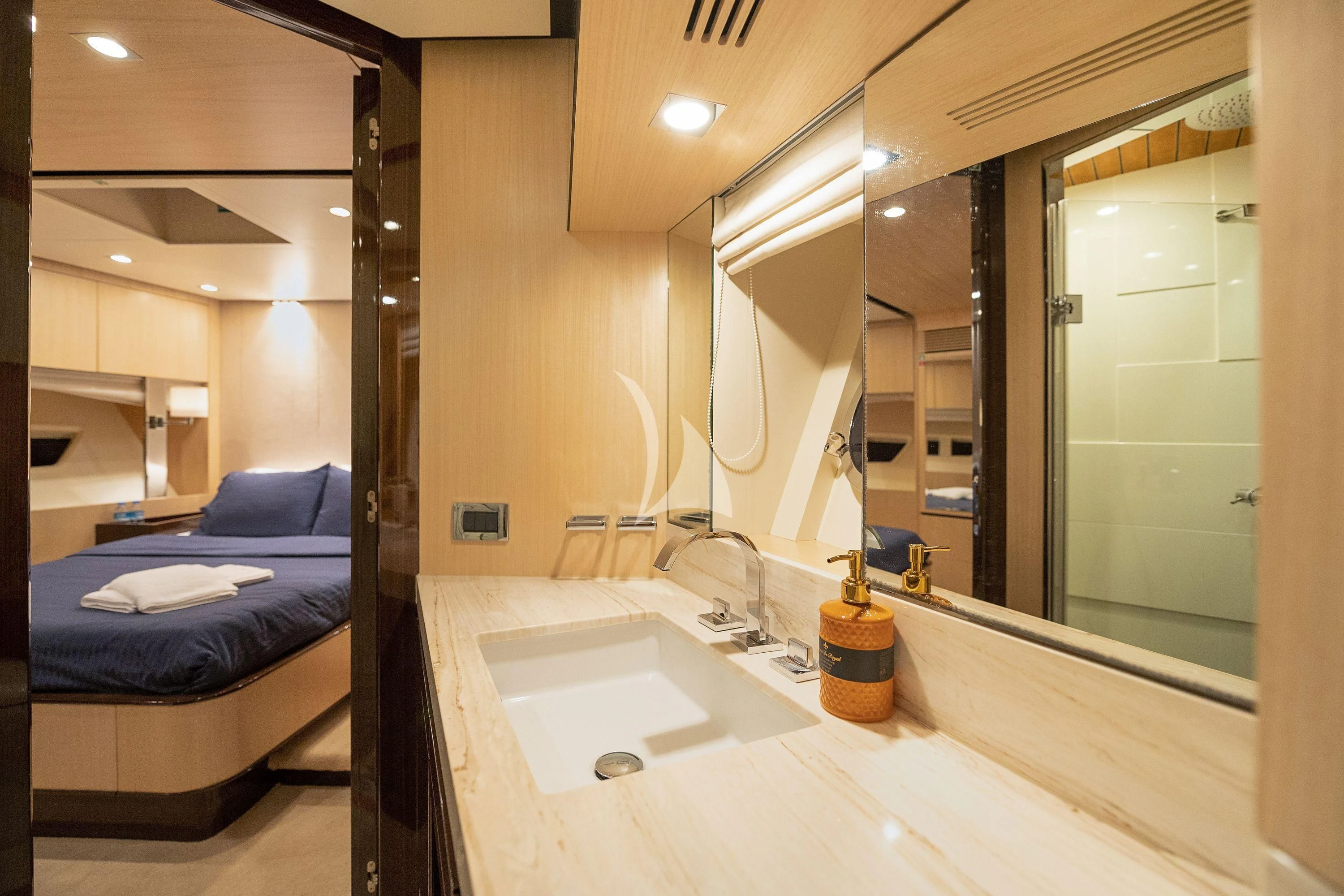 a bathroom with a sink and a bathtub aboard HUBO Yacht for Sale