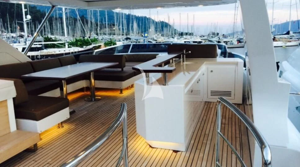 a room with a table and chairs aboard HUBO Yacht for Sale