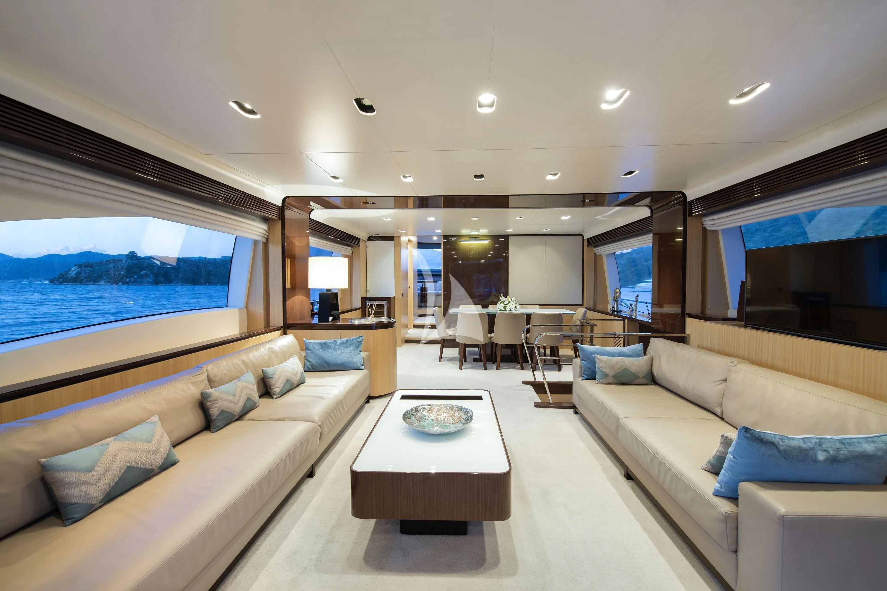 a living room with a large window aboard HUBO Yacht for Sale