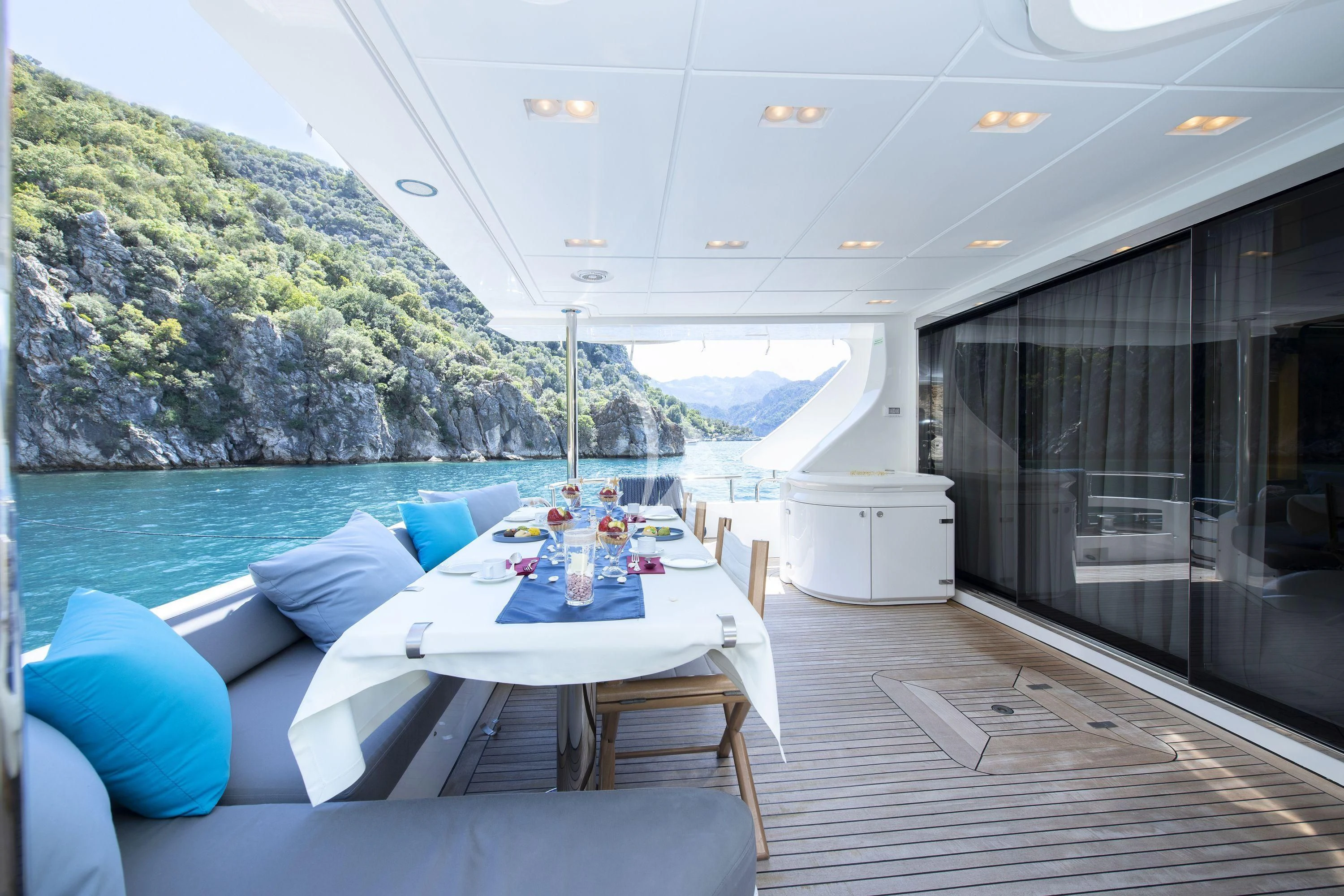 a room with a table and chairs aboard HUBO Yacht for Sale