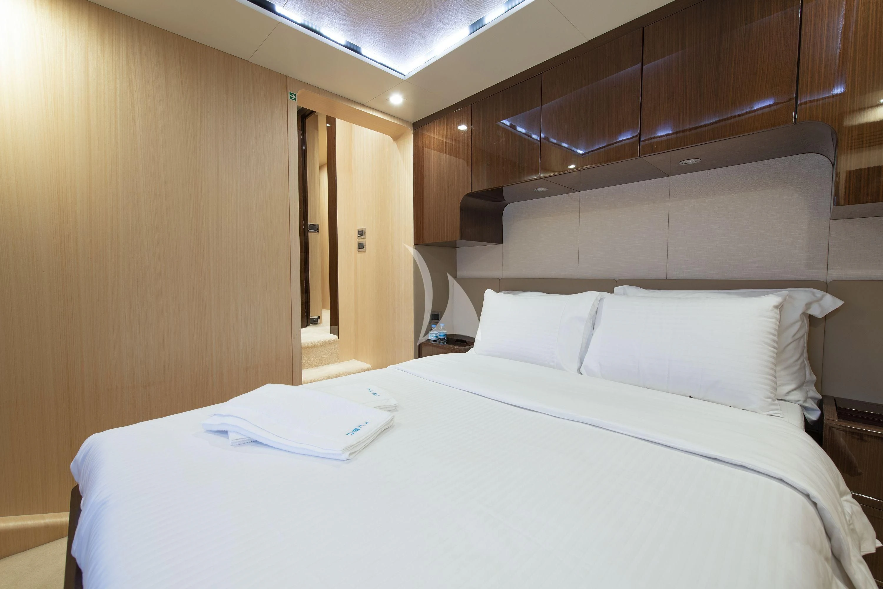 a bed with white sheets aboard HUBO Yacht for Sale